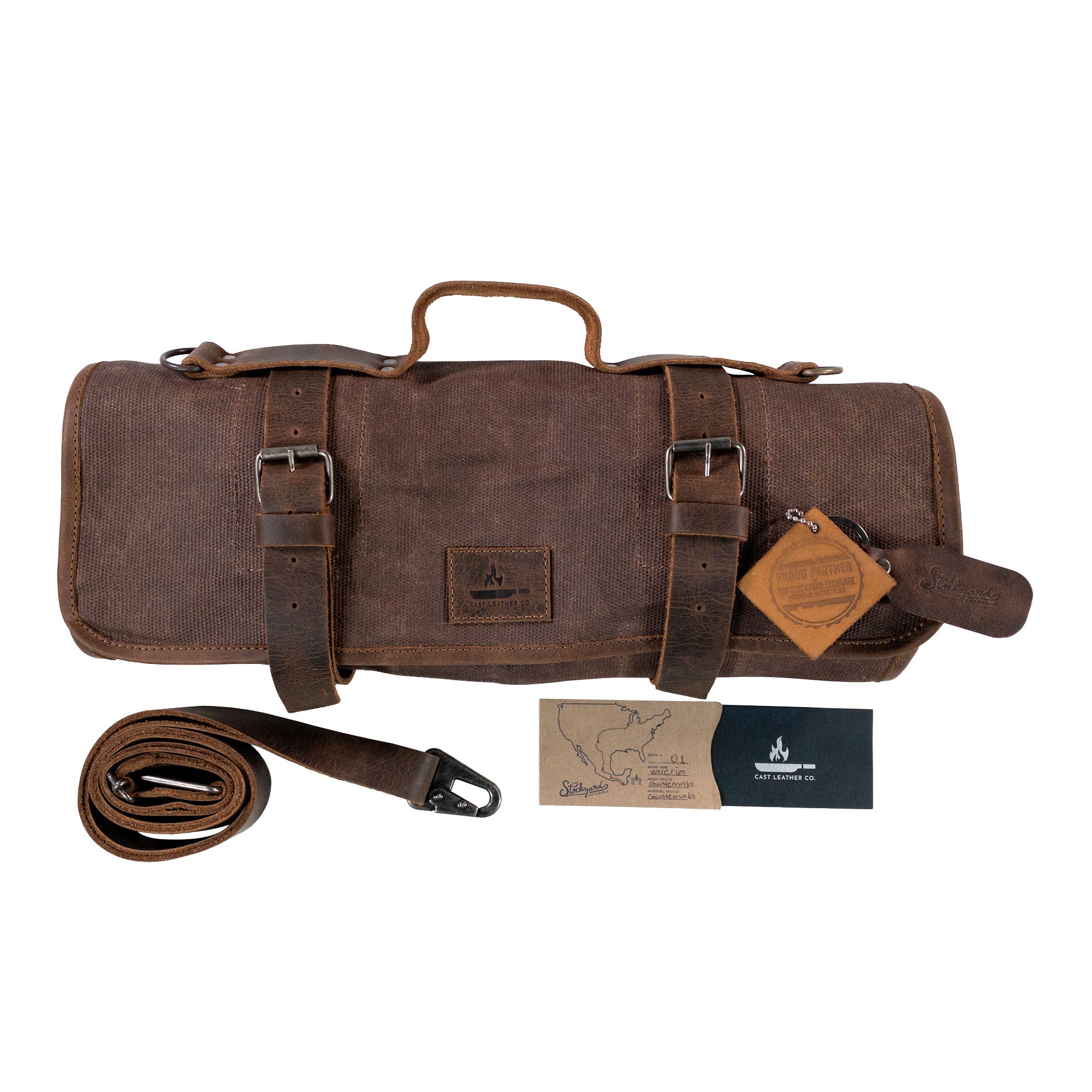 The Knife Roll with 8 Slots by Cast Leather Co. is beautifully presented with accessories included, highlighting its unique hand-crafted craftsmanship. Perfect for culinary enthusiasts, this portable knife organizer features durable waxed canvas and full grain leather, showcasing the small batch and artisan production from La Antigua Guatemala.
