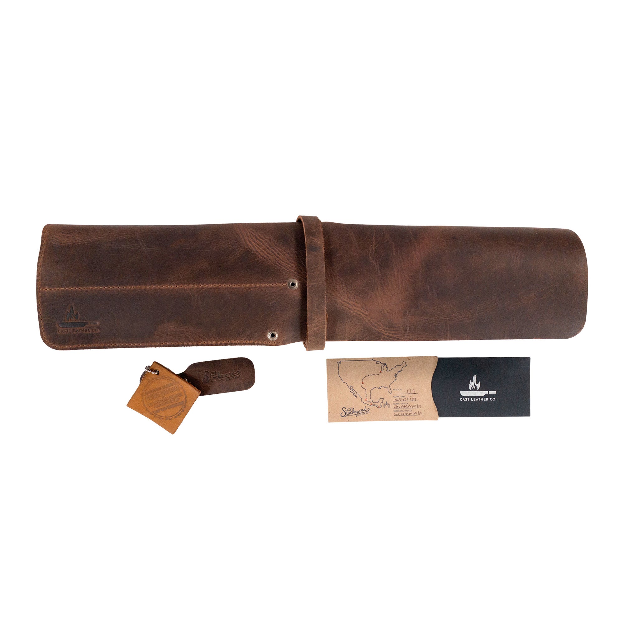 The Cast Leather Co. Rectangular Knife Case with 6 Slots fully closed with branding tags visible. This compact and elegant Rectangular Knife Roll with 6 Slots is a robust Portable Knife Organizer Case, made from Full Grain Leather. Ideal as a cooking accessory, it represents StockyardX’s ethos of small batch production and showcases hand cut, hand sewn craftsmanship, along with a fire branded mark, all handmade in La Antigua Guatemala & Oaxaca Mexico.