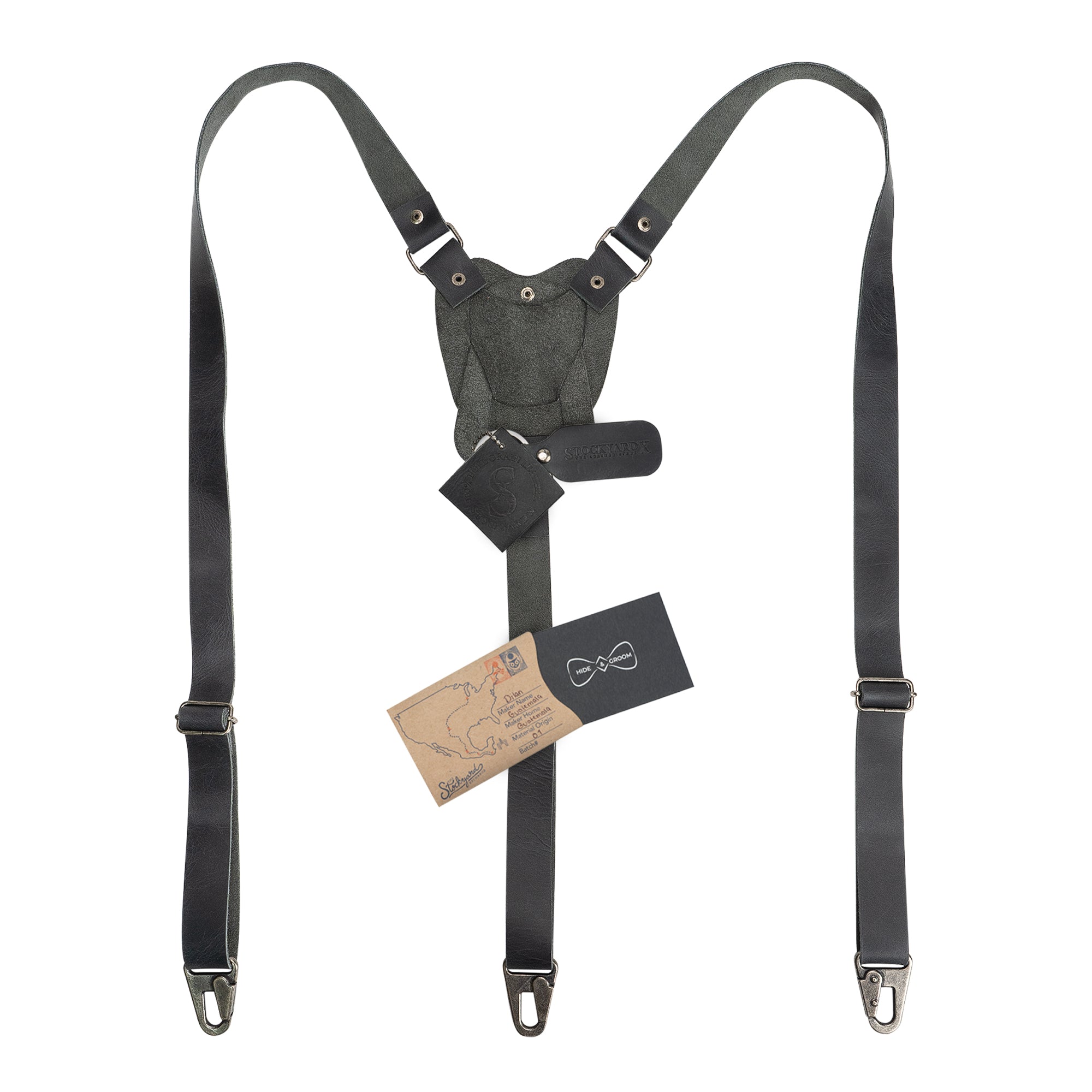 Rustic Suspenders with Adjustable Size Straps for Men in green by Hide & Groom, featuring tags and branding. Made from Full Grain Leather, these suspenders are perfect for weddings and add a stylish touch to any Steampunk outfit.