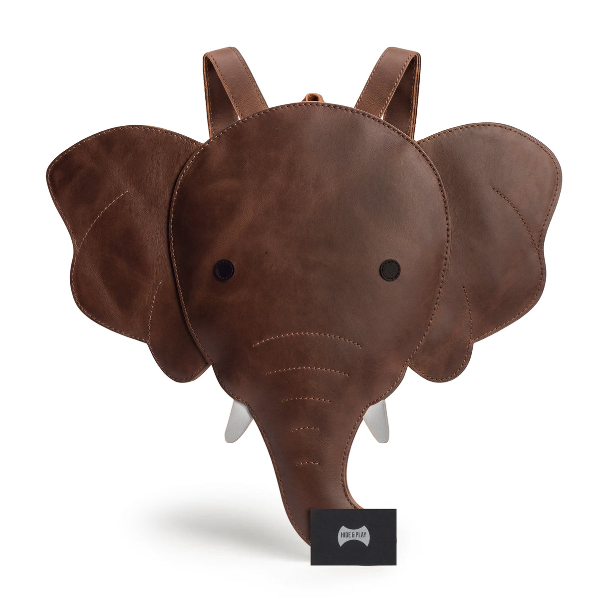 Handmade Elephant-Shaped Backpack by Hide & Play, featuring care instructions and quality details. This distinctive Full Grain Leather bag serves as an Elephant-Shaped Shoulder Bag, ideal as a Messenger Bag or Travel Bag for Men and Women. StockyardX takes pride in its artisan production in La Antigua Guatemala.