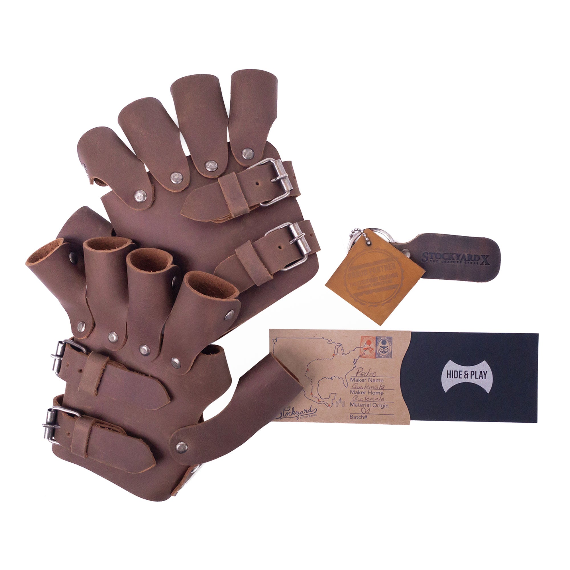 Packaging of the Set of 2 Steampunk Gloves from Hide & Play, displaying the unique artisan branding. Made from full grain leather, these vintage gloves are suitable for cosplay and feature small batch production craftsmanship from La Antigua Guatemala, making them ideal costume accessories.