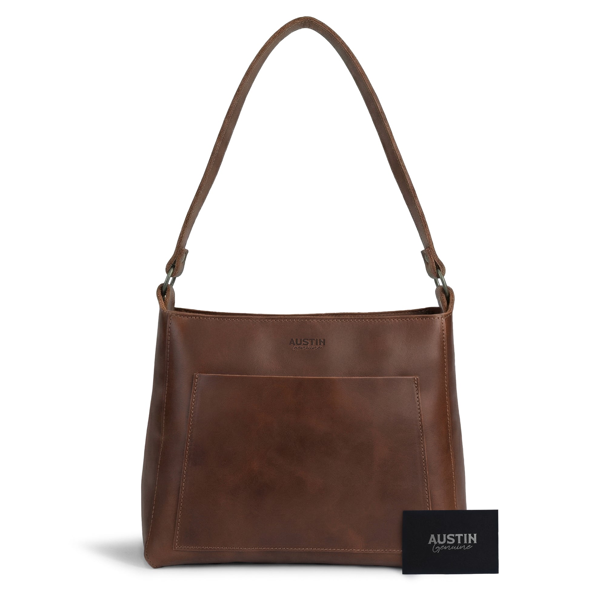 The Allandale Tote Bag by Austin Genuine, presented with a brand card beside it. This beautiful tote made from full grain leather showcases small batch production, hand cut, hand sewn, and fire branded details, reflecting its artisan quality handmade in La Antigua Guatemala & Oaxaca Mexico.
