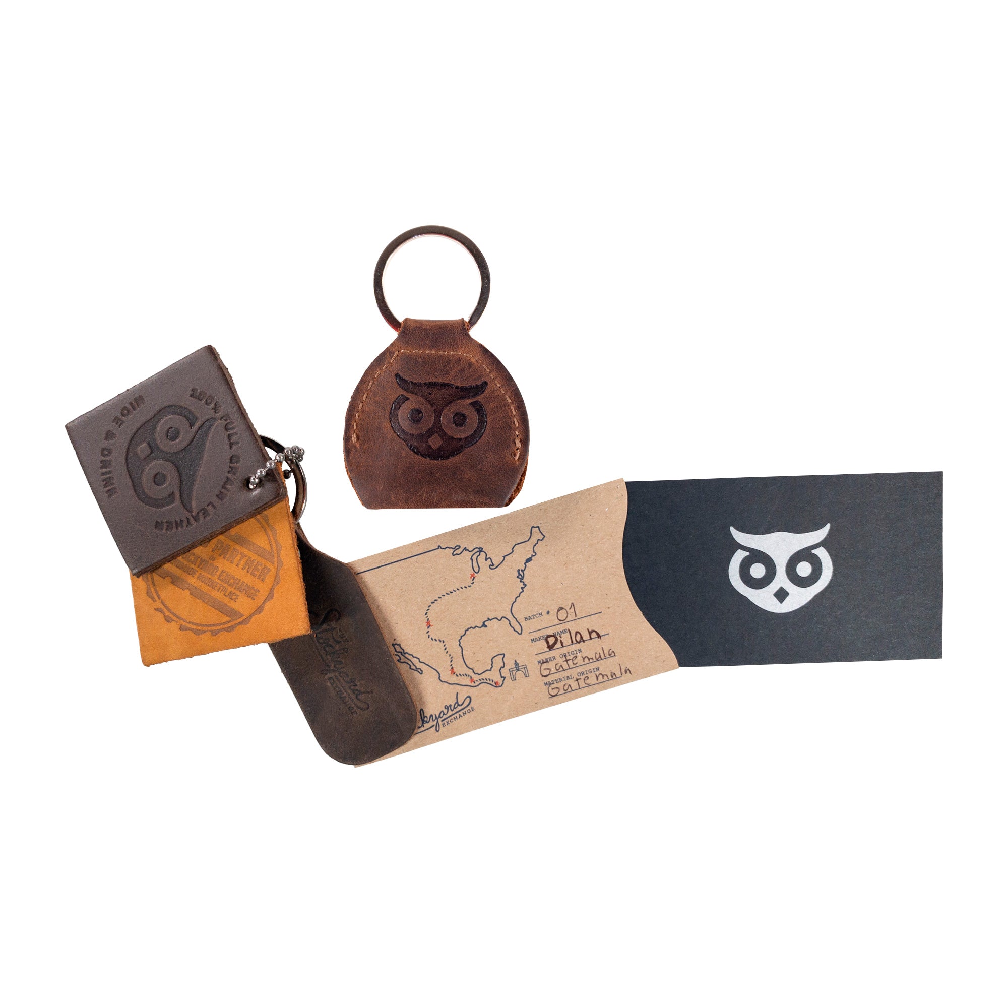 An artistic representation of the Key Chain & Guitar Pick Holder by Hide & Drink, displaying a complete setup that emphasizes its role as a Guitar Pick Holder with Ring and key organizer. Crafted from Full Grain Leather, this piece reflects the small batch production ethos of handmade products, including hand cut and hand sewn techniques from La Antigua Guatemala & Oaxaca Mexico.