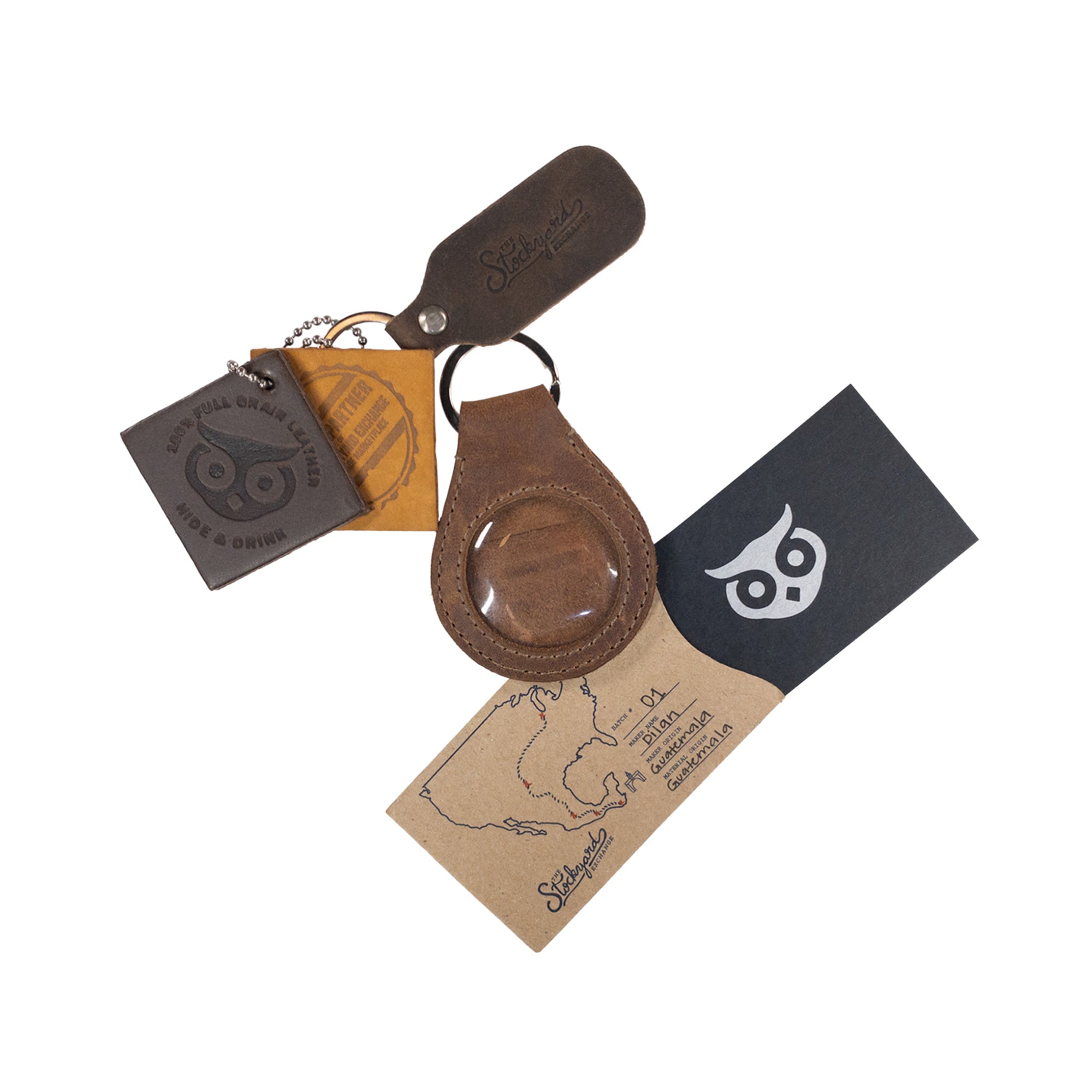 A collection view of the Medallion Holder Keychain by Hide & Drink, featuring its unique design with secure keyring attachment, perfect for storing keepsakes and memorabilia. Made from quality full grain leather, this product reflects artisan small batch production from La Antigua Guatemala & Oaxaca Mexico.