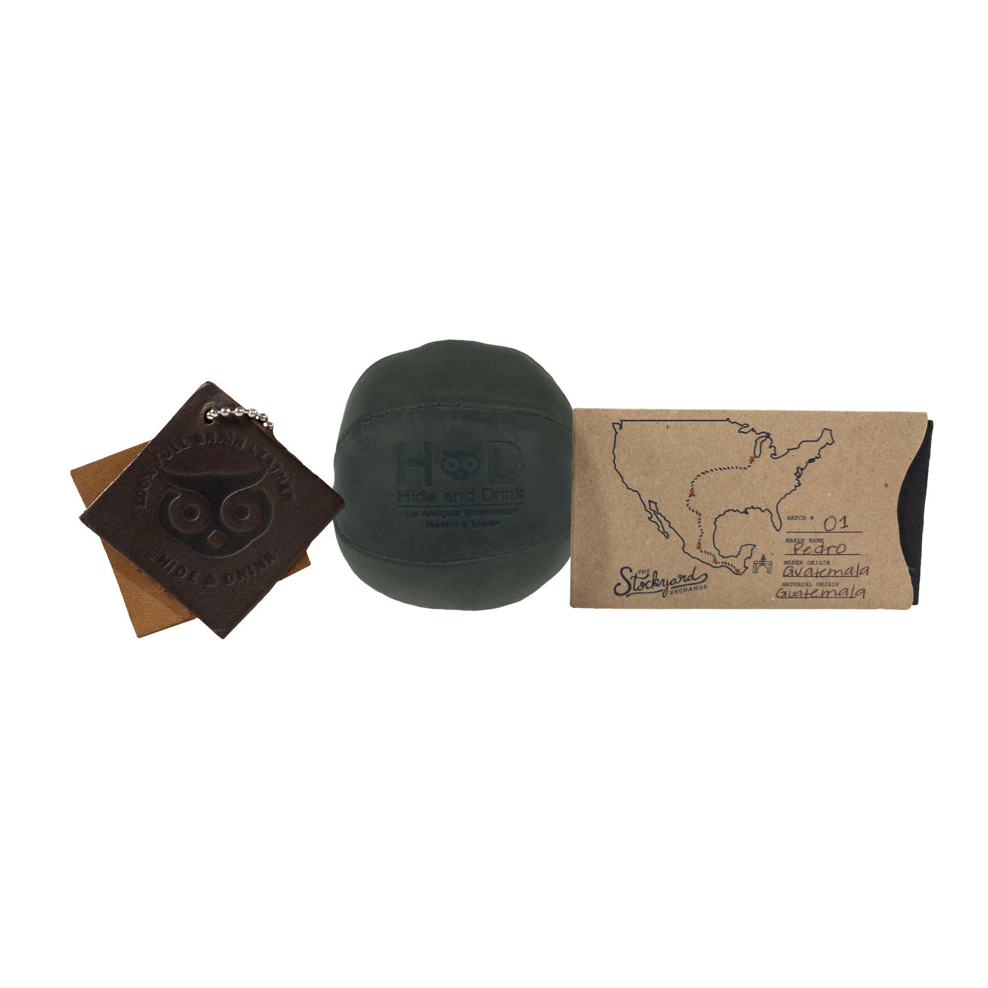 Hide & Drink green Stress Ball with packaging, emphasizing its quality as a gift option for anyone. This squishy tension accessory helps relieve fidgeting and anxiety, artisan crafted in La Antigua Guatemala.