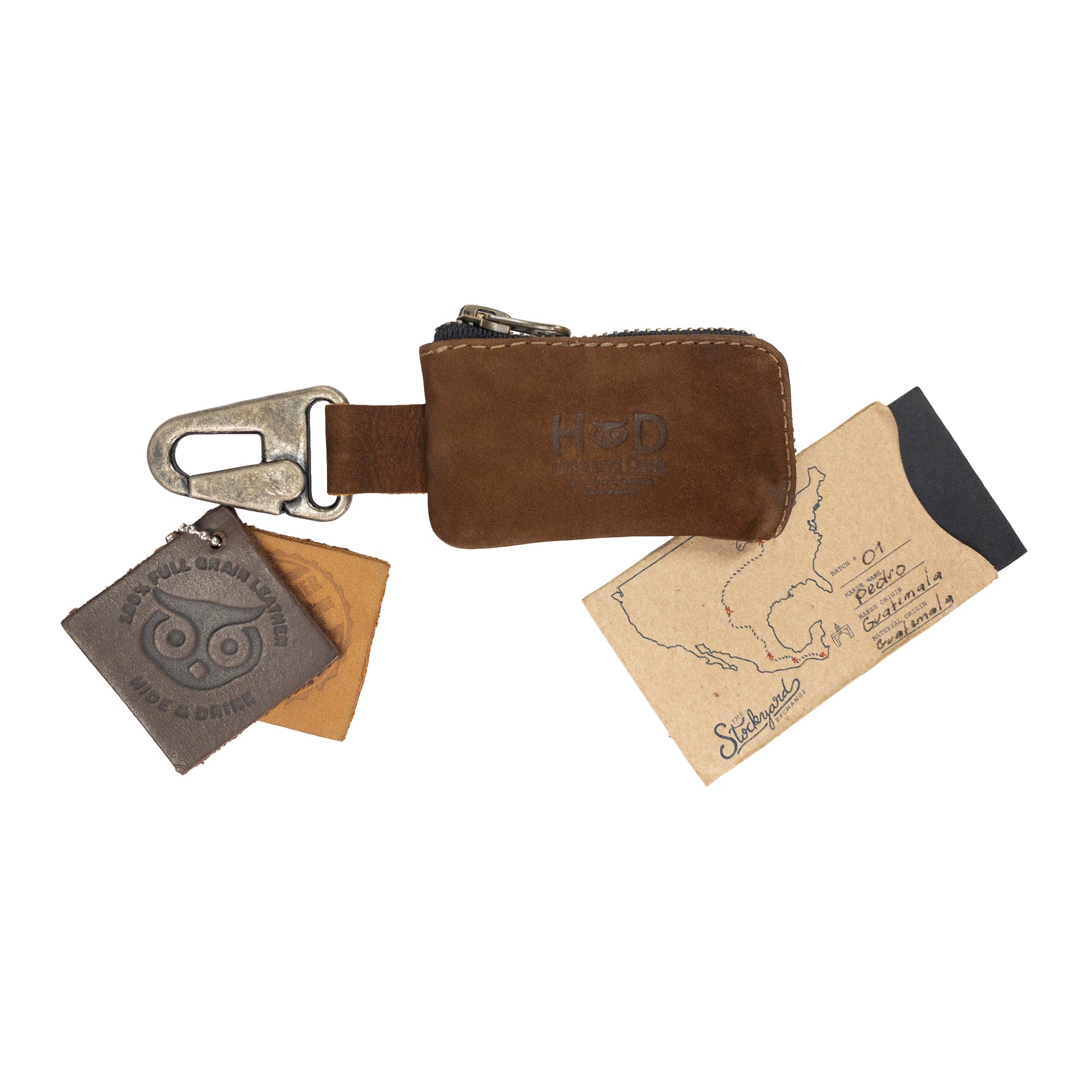 Hide & Drink's Car Key Holder comes beautifully packaged, showcasing its rustic leather design and artisan craftsmanship. This Car Key Holder is perfect for storing cash, headphone and charging cables, memory cards, and flash drives in a secure zipper case with a nickel metal clasp. It reflects the excellence of small batch production, hand cut and hand sewn quality, handmade in La Antigua Guatemala & Oaxaca Mexico.
