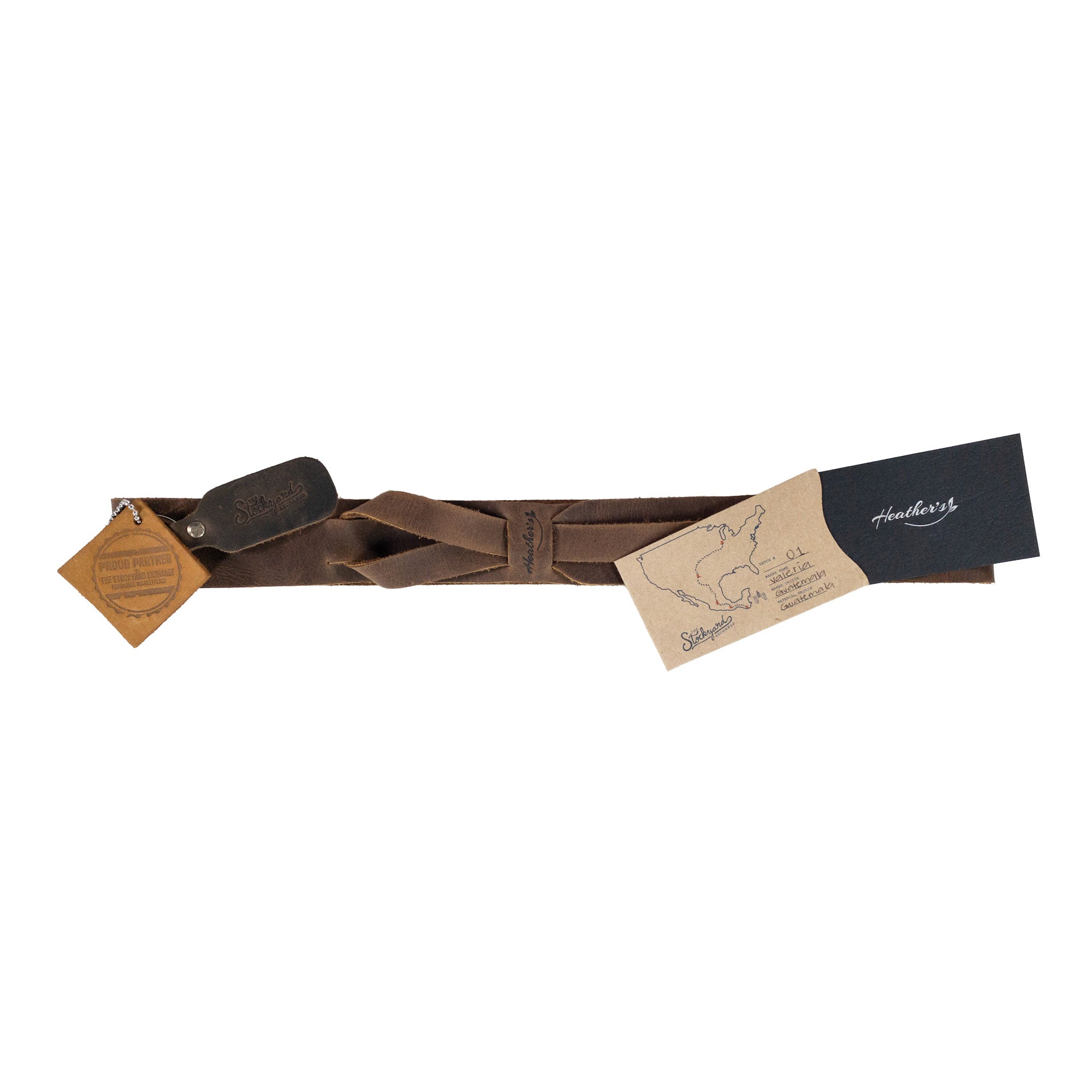 Packaging of Heather's Fashion Belt for Women featuring a no-buckle strap and artisan tags. This full grain leather waist accessory is perfect for gifting, emphasizing handcrafted quality from La Antigua Guatemala. Fashion Belt for Women without Buckle, No-Buckle Belt, Stylish Belly Accessory, Small Batch Production, Hand Cut, Hand Sewn, Fire Branded, Artisan.