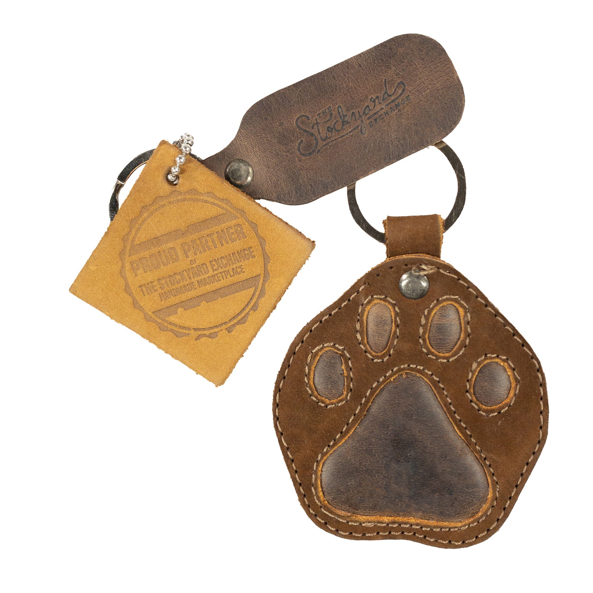 Exclusive Dog Paw Keychain from Taco Dog, paired with branded tags, made from high-quality full grain leather. This cute stitched key ring fob is an ideal gift and is handcrafted with dedication in La Antigua Guatemala & Oaxaca Mexico. Emphasizing small batch artisan production.