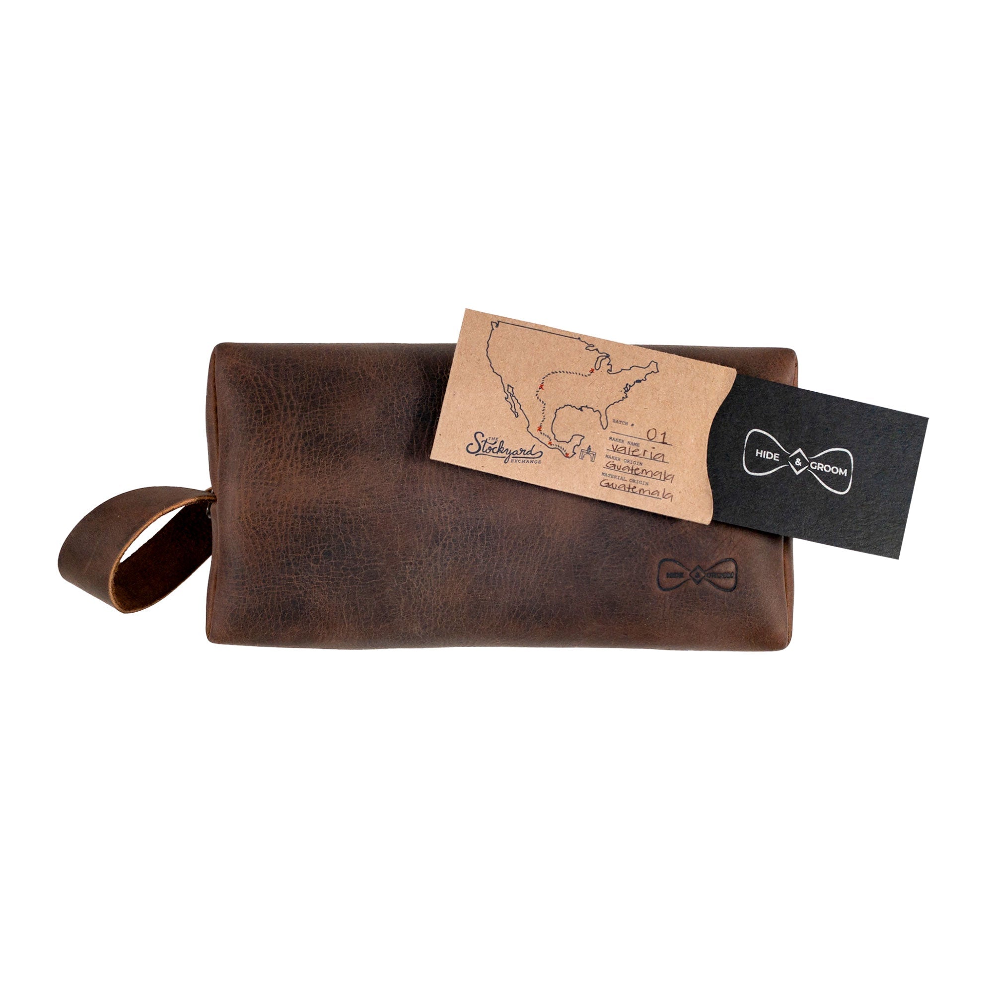 Hide & Groom's rustic toiletry bag for groomsmen alongside a detailed product card, emphasizing its handmade nature and artisan craftsmanship. Ideal for best men and wedding ceremonies, this full grain leather bag is a sophisticated storage solution for grooming essentials.