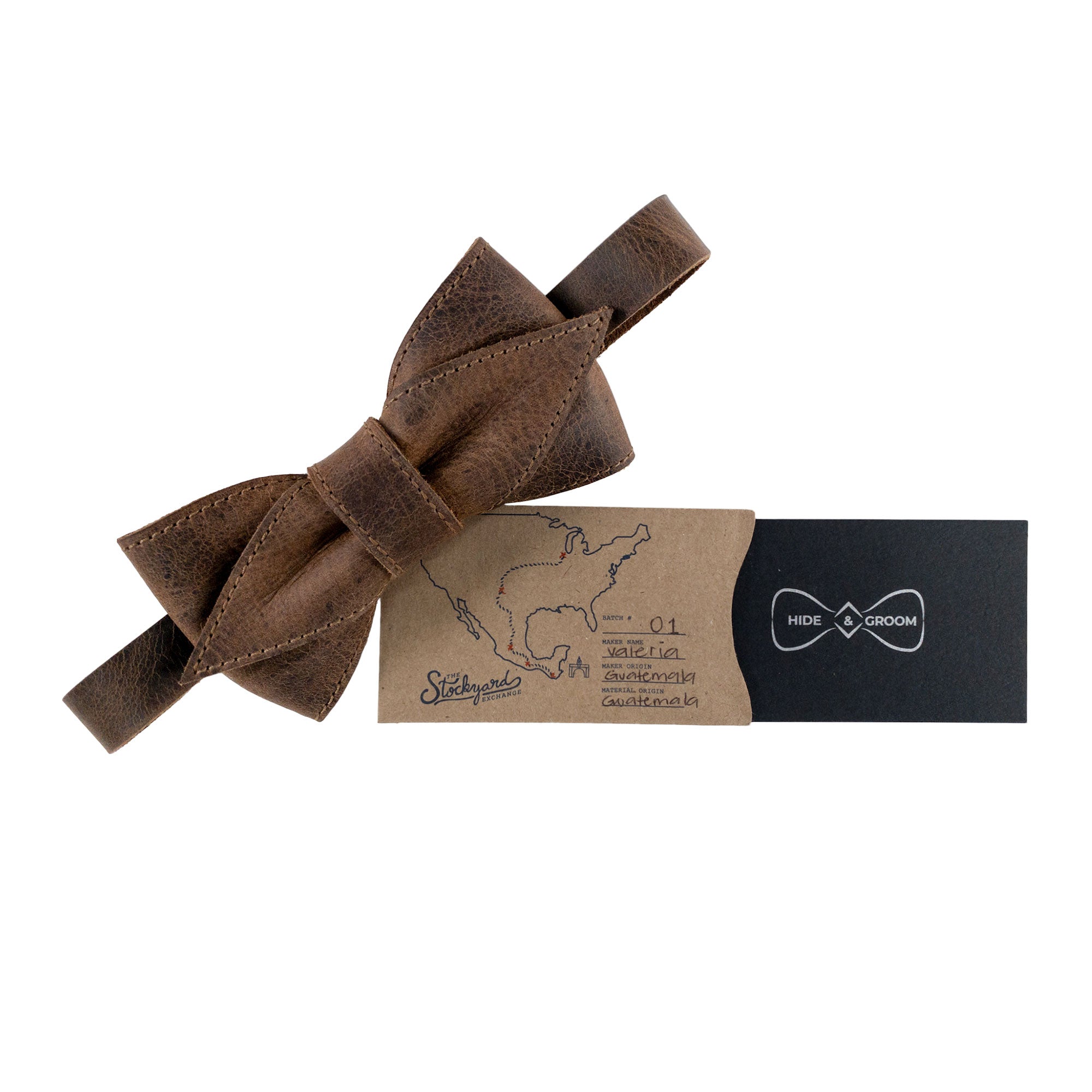 Presentation of the Pointed Bow Tie for Groomsmen by Hide & Groom, elegantly packaged with a card. The pre-tied bow tie in full grain leather represents small batch production handcrafted in La Antigua Guatemala & Oaxaca Mexico, making it an exceptional choice for formal wear for men.