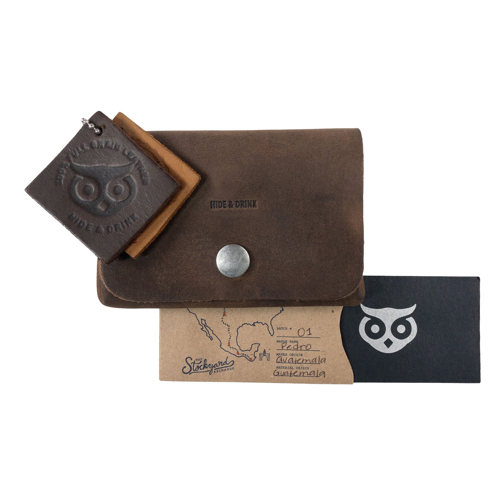 Content of the Double Pouch Card Wallet by Hide & Drink, including additional items alongside the wallet. This Leather Double Pouch Card Wallet is ideal for carrying cards, cash, and more, serving as a double pouch for men and women. Handcrafted in La Antigua Guatemala & Oaxaca Mexico.