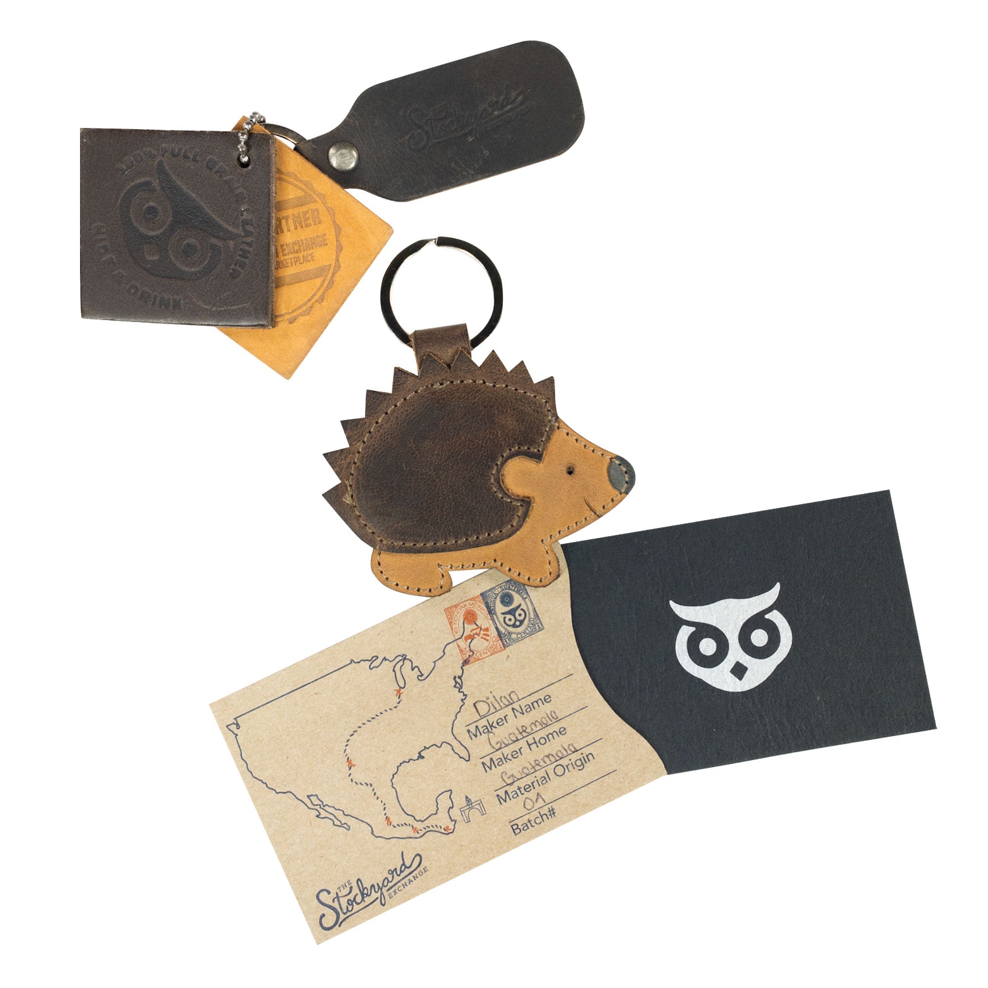 Porcupine Keychain alongside accessories and branding materials, highlighting its artisan heritage. This cute wildlife-themed key ring holder is made by Hide & Drink from Full Grain Leather, showcasing small batch production and fire branded details. Handmade with love in La Antigua Guatemala & Oaxaca Mexico, perfect for gifting.