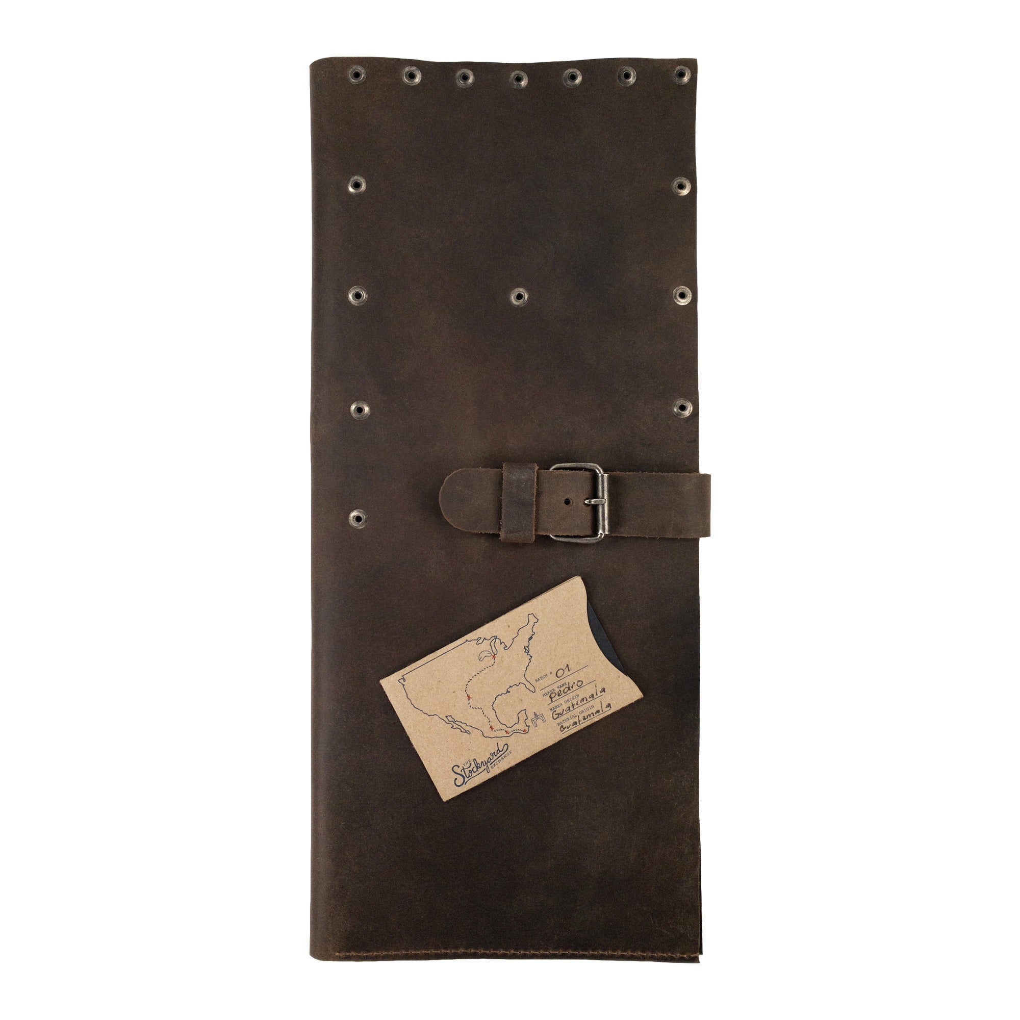 Riveted Chef Knife Case by Cast Leather Co., featuring an elegant leather finish and a buckle design, showcasing its handmade quality and durability. This kitchen tools organizer and culinary accessory is a product of stockyardX small batch production, artisan-crafted in La Antigua Guatemala & Oaxaca Mexico.