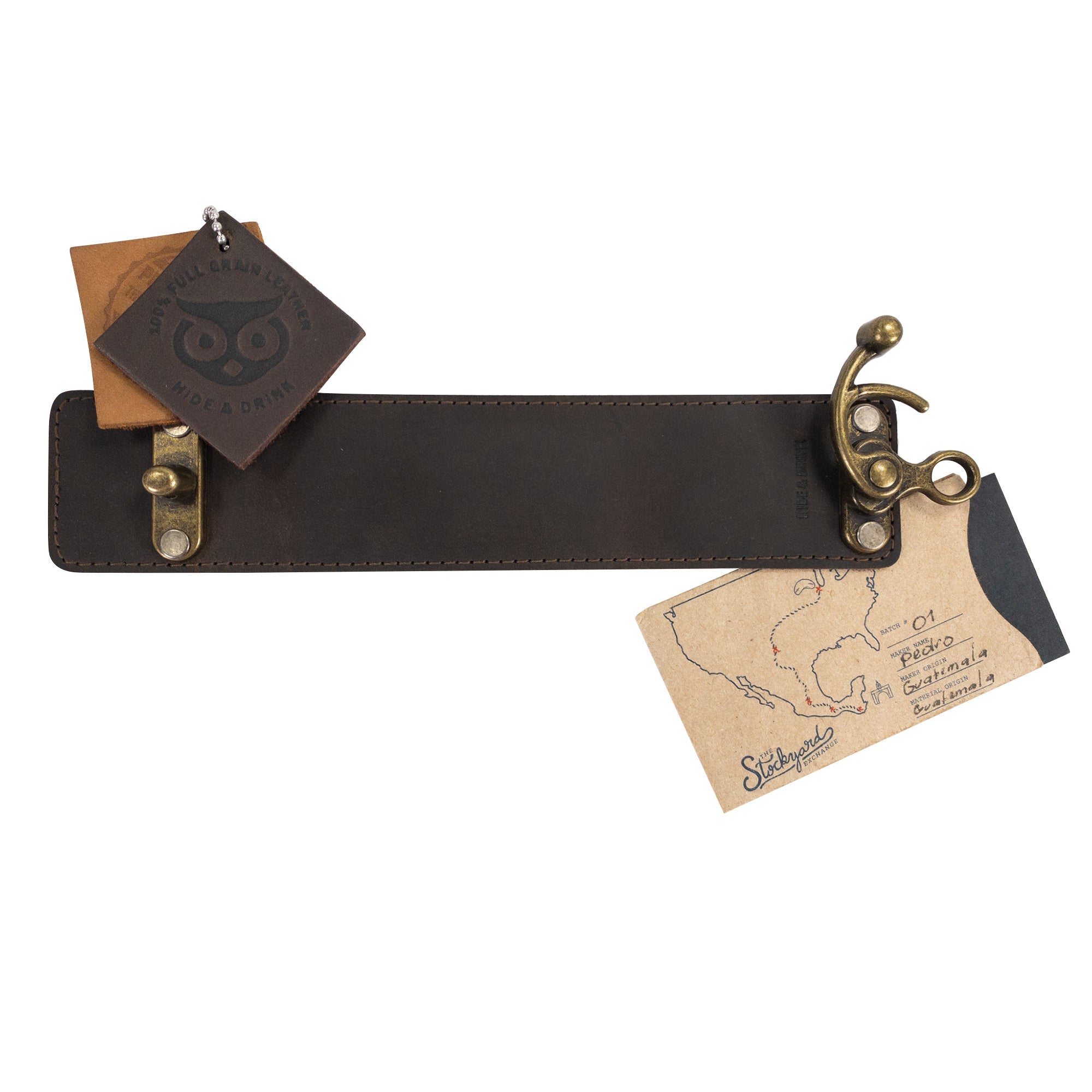 Display of the Hide & Drink 8 Inch Wristband with Vintage Clasp with packaging, emphasizing the craftsmanship. This wristband is fashioned from Full Grain Leather and embodies small batch production values, being hand cut, hand sewn, and fire branded by artisans in La Antigua Guatemala & Oaxaca Mexico.