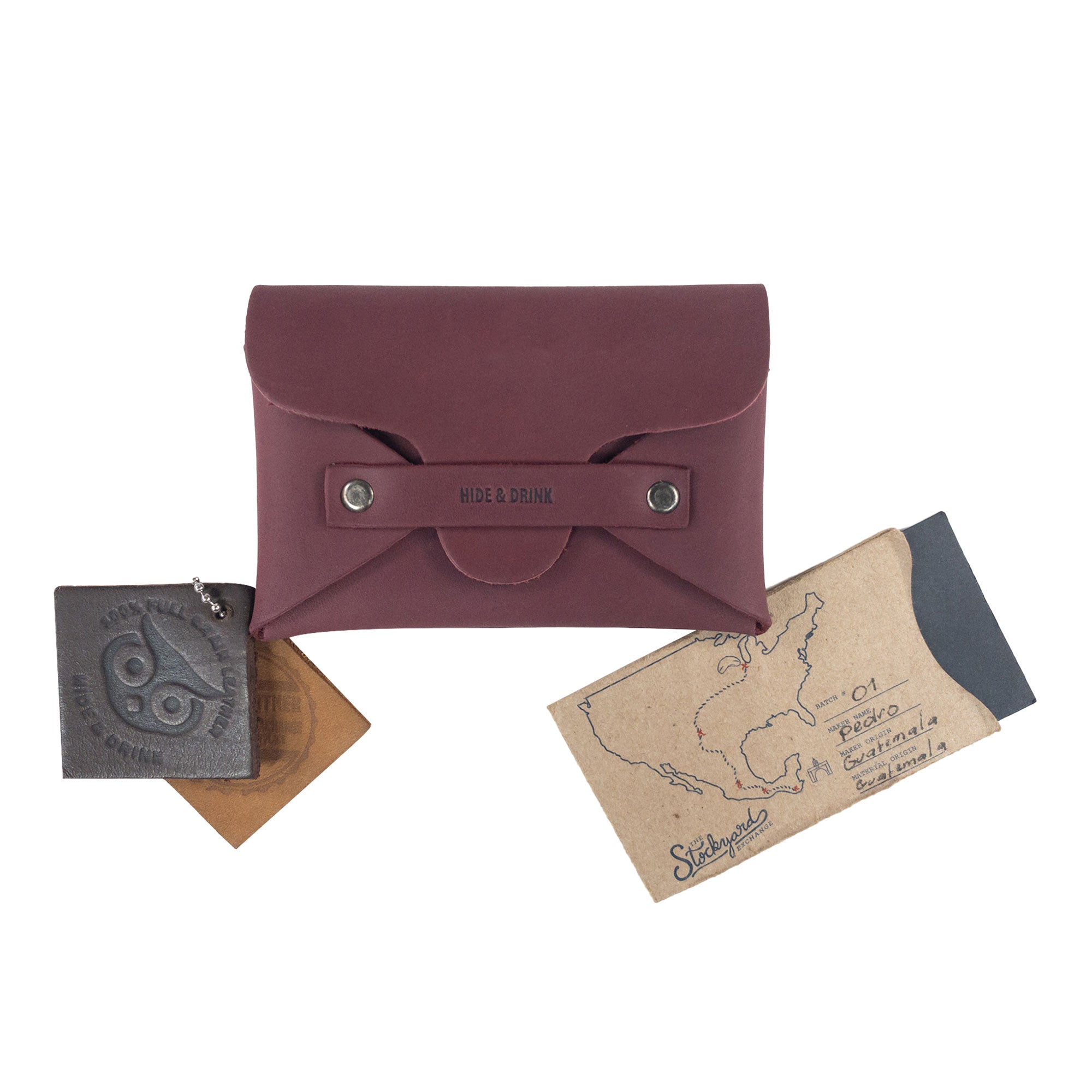 Hide & Drink's Snapless Business Card Holder displayed with cards and documents. This dynamic Snapless Business Card Holder for Men and Women offers a stylish and practical solution as a sturdy pouch and money organizer. Made from durable Full Grain Leather, it emphasizes small batch production with artisan craftsmanship from La Antigua Guatemala & Oaxaca Mexico.