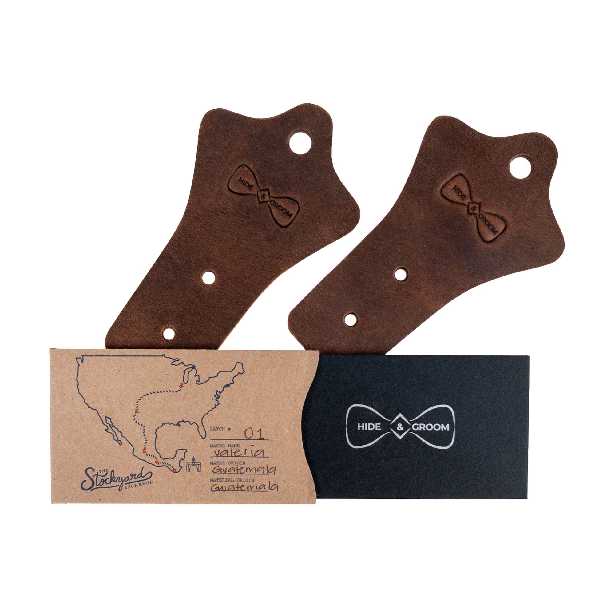 Hide & Groom Set of 2 Buckle Belt Hangers packaged elegantly, great for gifting. These full grain leather hangers are perfect for organizing belts in closets or as rustic accessories for groomsmen. Proudly handmade in La Antigua Guatemala, emphasizing artisan craftsmanship and small batch production.