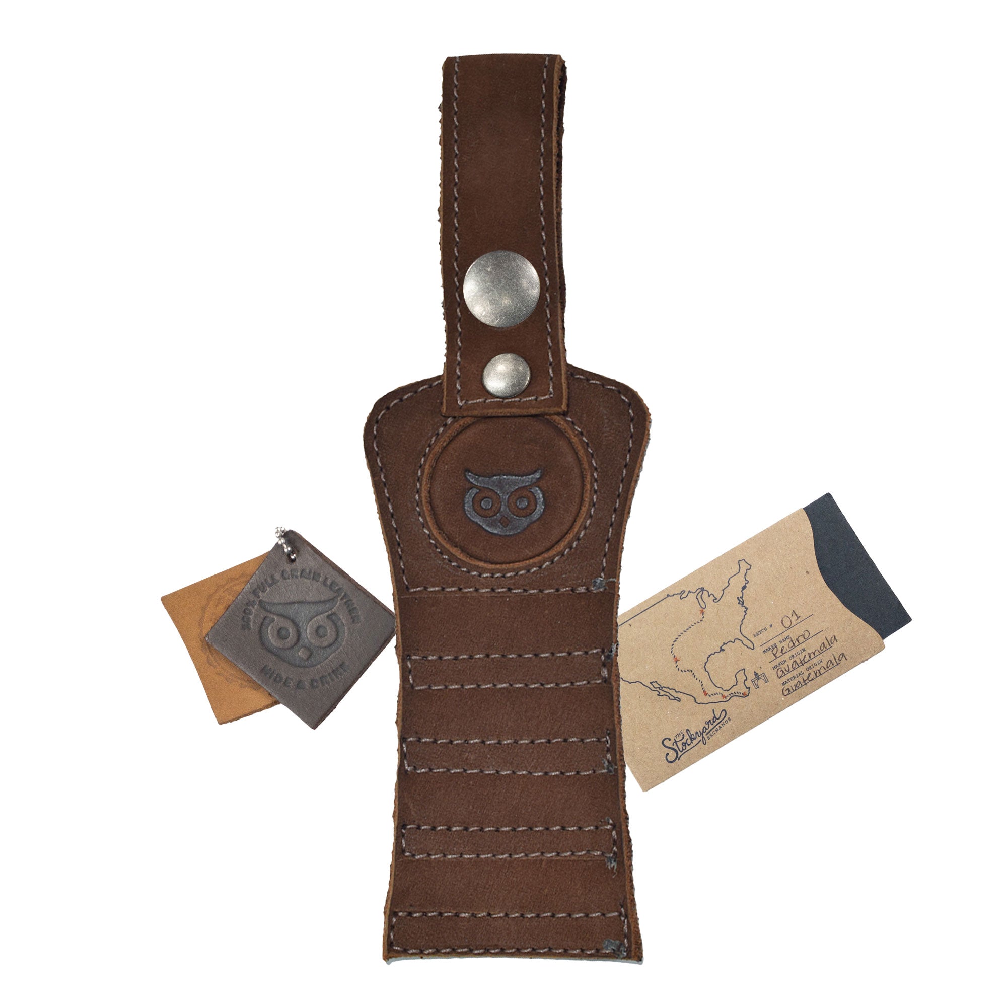 Hide & Drink Golf Tee Holder with branding, demonstrating its artisan quality. This stylish full grain leather accessory is designed for convenient fitting to a golf bag or belt, making it an ideal gift for golfers, handmade in La Antigua Guatemala.
