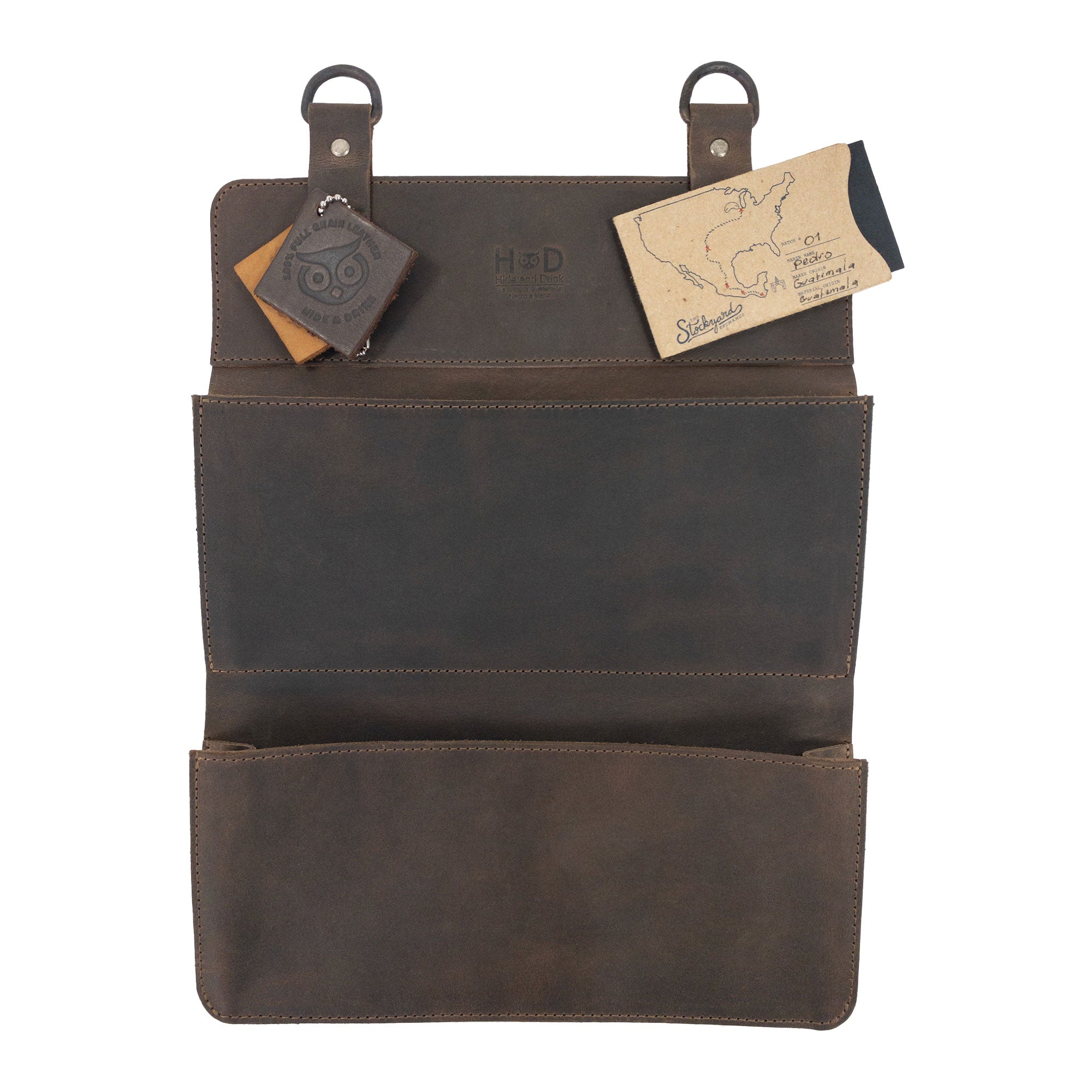 Hide & Drink Double Document Holder for Hanging styled with cards, showcasing its functionality for wall mount file storage. Made of durable full grain leather, this piece embodies artisan craftsmanship, small batch production, hand cut, hand sewn, and fire branded, proudly handmade in La Antigua Guatemala & Oaxaca Mexico.