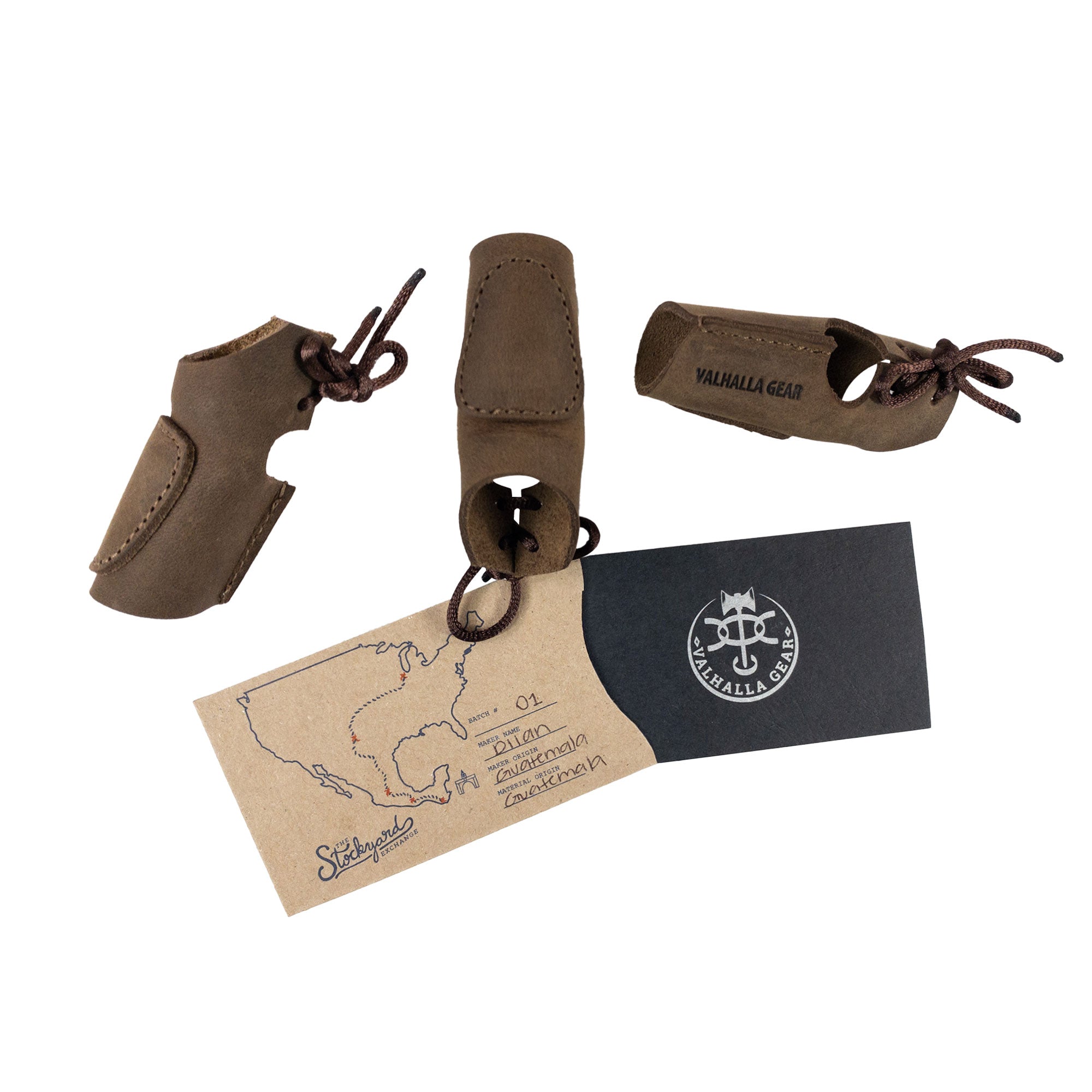 The Set of 3 Finger Protectors for Archery by Valhalla Gear, presented with a tag showcasing its artisan craftsmanship. This set includes full grain leather finger guards for archer accessories, tailored for recurve bows and shooting targeting. Each piece reflects the heritage of small batch production through its hand cut and hand sewn details, proudly handmade in La Antigua Guatemala.