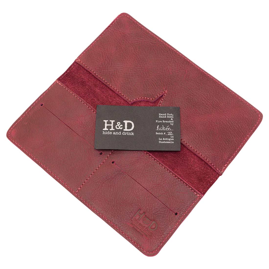 Open bifold wallet for cellphone by Hide & Drink showcasing the logo and product details. This functional Bifold Wallet for Cellphone is made from Full Grain Leather, designed with style and usability in mind. Experience the artisanal quality from small batch production in La Antigua Guatemala & Oaxaca Mexico.