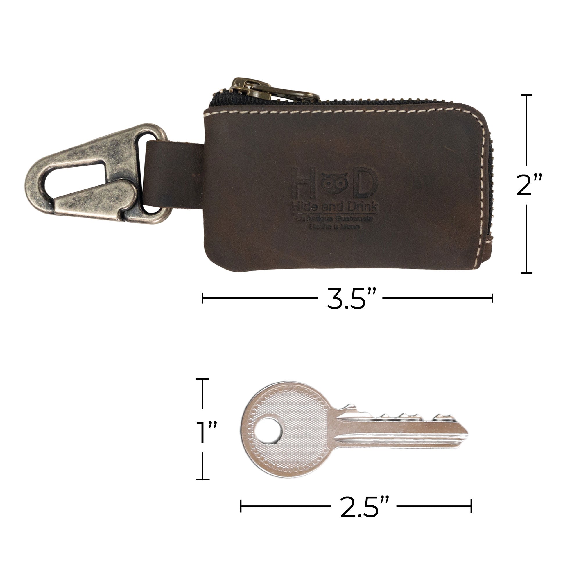 Another view of the brown Car Key Holder by Hide & Drink, highlighting its functional design for holding keys and cash alongside accessibility for Headphone and charging Cables, Memory Cards, and Flash Drives. Crafted from premium Full Grain Leather and featuring a Nickel Metal Clasp, reflecting artisan skills from Small Batch Production in La Antigua Guatemala & Oaxaca Mexico.