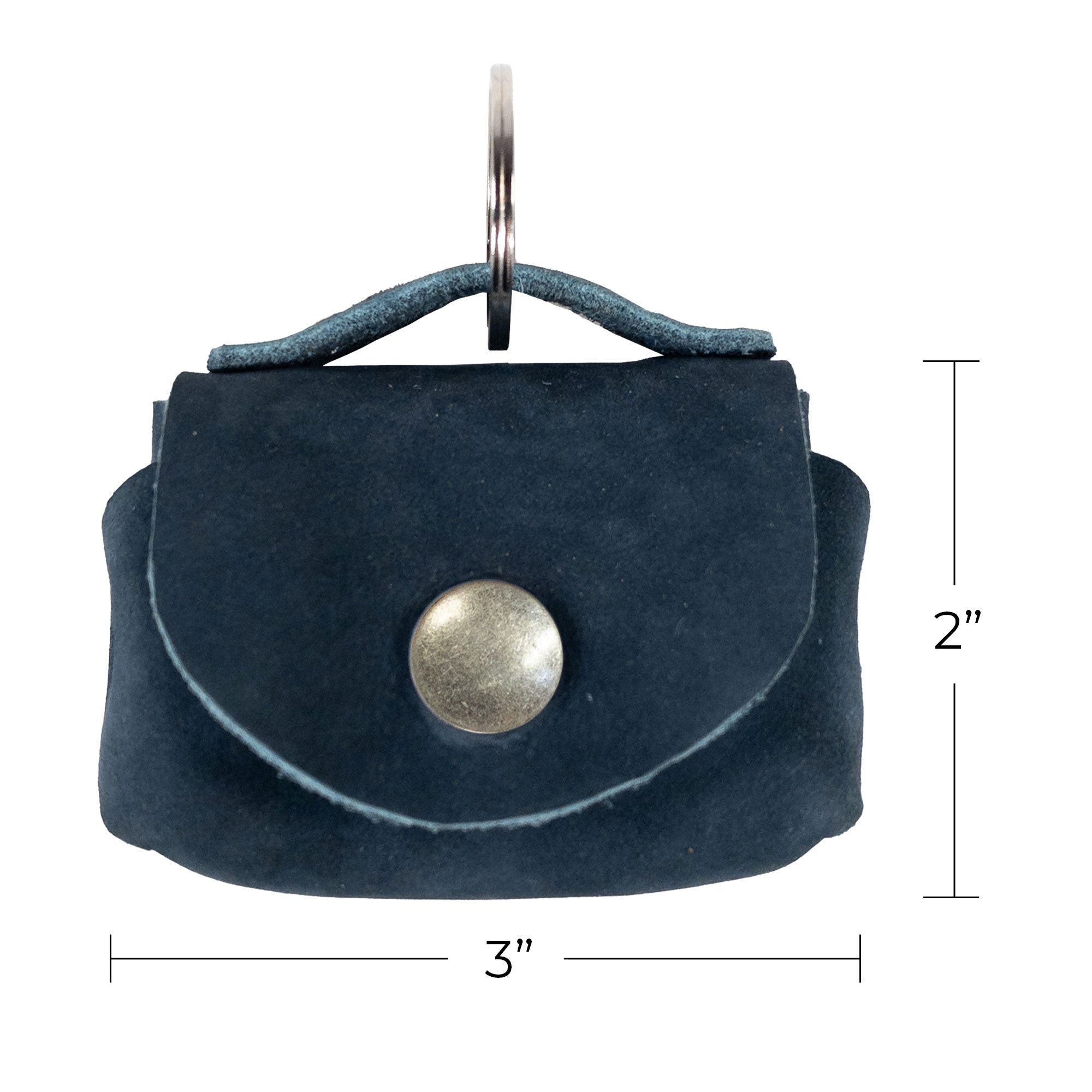 Tiny Handbag Keychain by Hide & Drink displayed with accompanying tags and brand info, highlighting its authenticity. This Tiny Handbag with Key Ring Holder is crafted from Full Grain Leather, featuring small batch production, hand cut and hand sewn craftsmanship, fire branded, and proudly handmade in La Antigua Guatemala & Oaxaca Mexico.