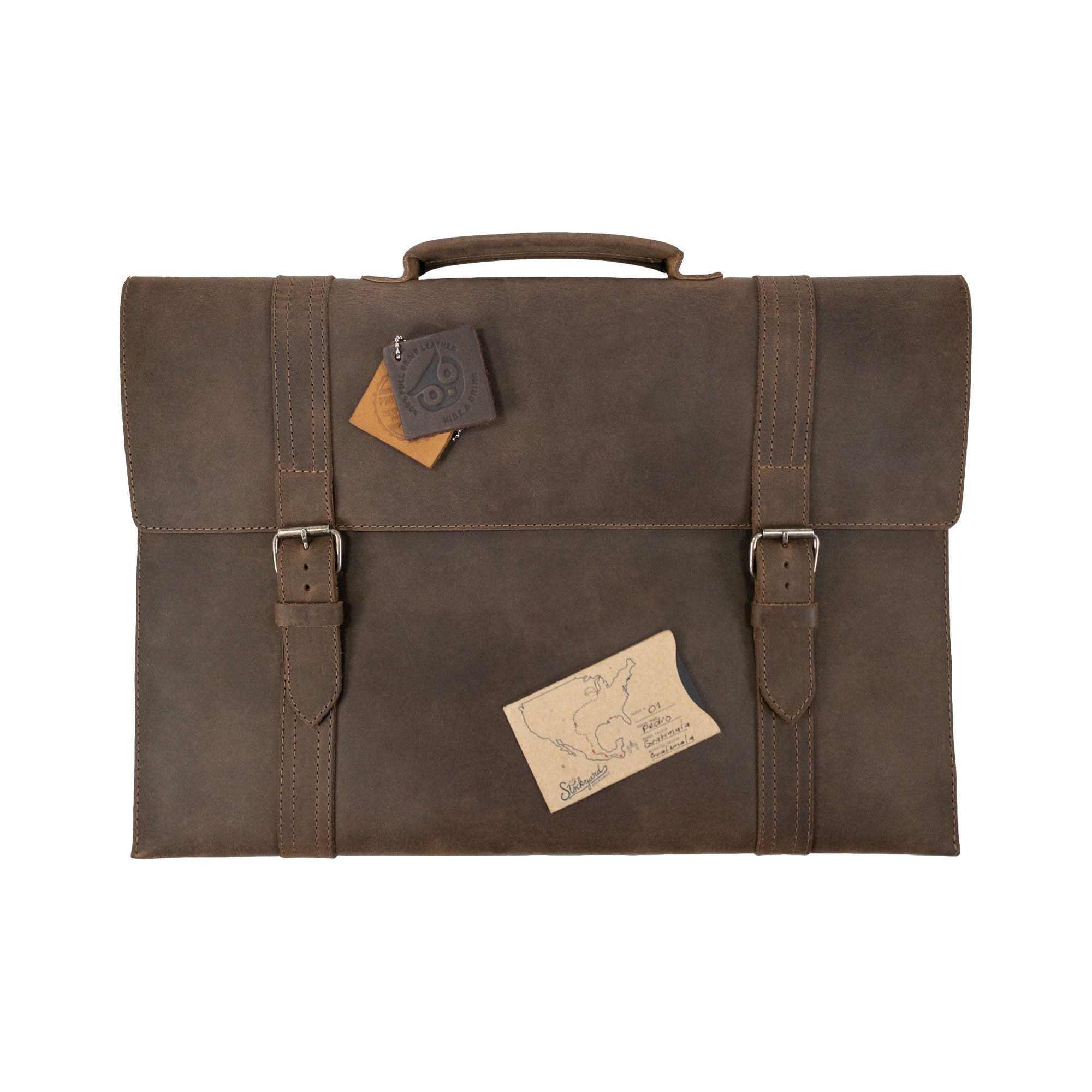 The Hide & Drink Portable Laptop Case styled with accessories, highlighting its practical design in full grain leather, hand cut and sewn, making it a perfect gift for any tech lover.