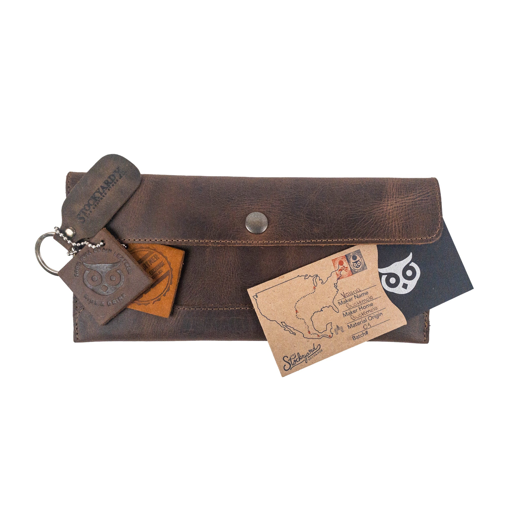 Hide & Drink's Travel Hand Wallet with keychains and cards, showcasing the rugged Full Grain Leather design. A prime example of a Travel Wallet crafted through Hand Sewn methods in La Antigua Guatemala & Oaxaca Mexico.