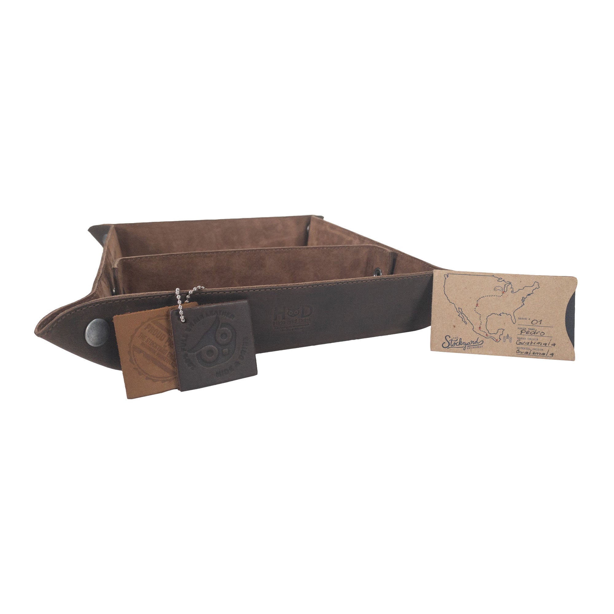A Rectangular Catchall with Removable Compartment by Hide & Drink, beautifully designed to hold everyday essentials, including a leather tag displaying its authenticity. Made from Full Grain Leather & Sheepskin, this desktop storage item represents Small Batch Production, Hand Cut, Hand Sewn, and Fire Branded artistry from La Antigua Guatemala & Oaxaca Mexico.
