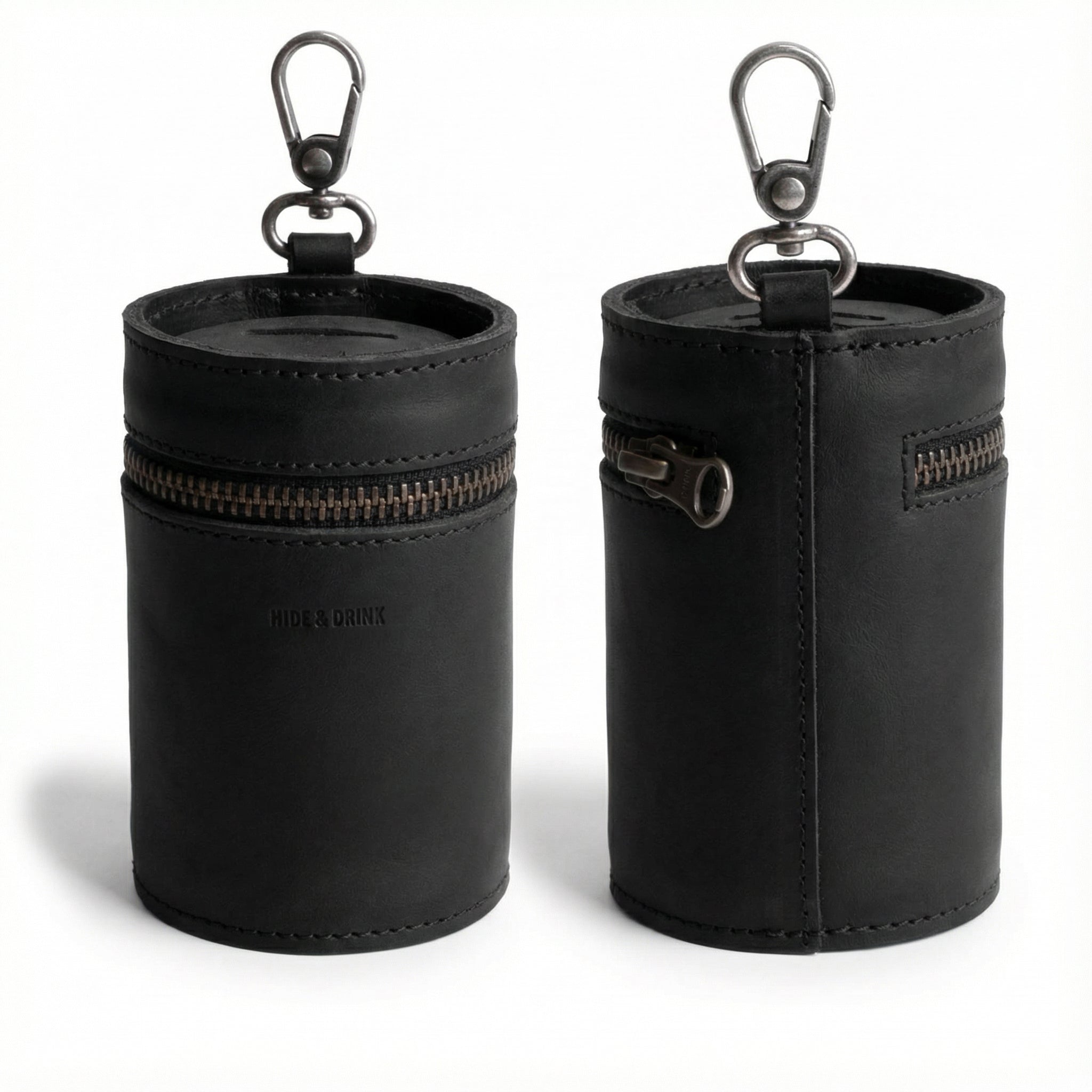 Front and back view of the Bucket Coin Release by Hide & Drink, a stylish piggy bank bucket made from full grain leather. This artisan zippered pouch serves as a cash organizer and coin case, showcasing small batch production techniques. Handmade in La Antigua Guatemala and Oaxaca Mexico, the money box features a durable clasp and is meticulously hand cut and hand sewn. Perfect for anyone looking for a functional yet elegant money-saving solution.