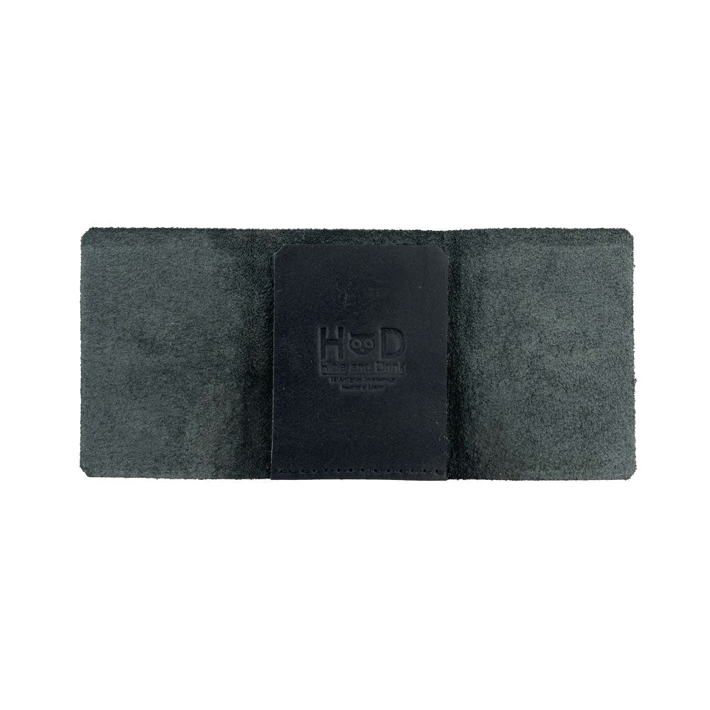 A lifestyle shot of the Hide & Drink Minimalist Wallet Bills Only with cash, illustrating its design and function as an Ultra Minimalist Wallet. Crafted from Full Grain Leather, this cash organizer showcases meticulous artisan work from La Antigua Guatemala.
