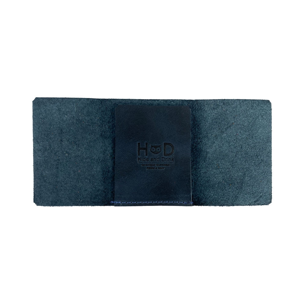 A profile view of the Hide & Drink Minimalist Wallet Bills Only that highlights its compact and Ultra Minimalist design. Crafted from durable Full Grain Leather, this wallet serves as an efficient cash organizer, featuring handcrafted details from local artisans.