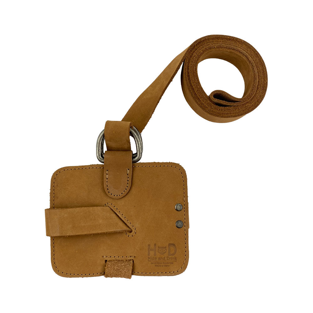 The Hide & Drink Book Strap Carrier from above, emphasizing its adjustable strap and high-quality Full Grain Leather. Handcrafted in La Antigua Guatemala by artisans, it's a perfect gift for those who love reading.