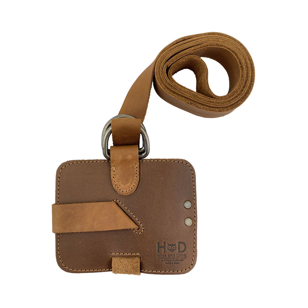 An overhead shot of the Hide & Drink Book Strap Carrier, displaying its practical features and adjustable strap. Artisan-crafted from Full Grain Leather in La Antigua Guatemala, it’s a great choice for stylish book lovers.