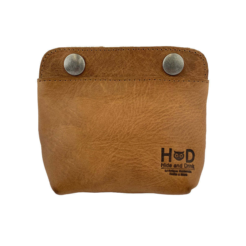 Front view of Hide & Drink's Double Snap Pouch in soft tan leather, showcasing its utility as a coin purse and cash & card holder. This artisan-crafted full grain leather product is made in La Antigua Guatemala.