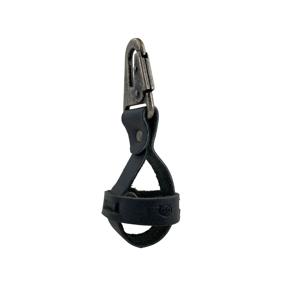 Sleek black Golf Ball Holder by Hide & Drink with a robust belt loop hook, made of rustic full grain leather. This artisan piece is hand cut, hand sewn, and fire branded in La Antigua Guatemala & Oaxaca Mexico, showcasing small batch production.