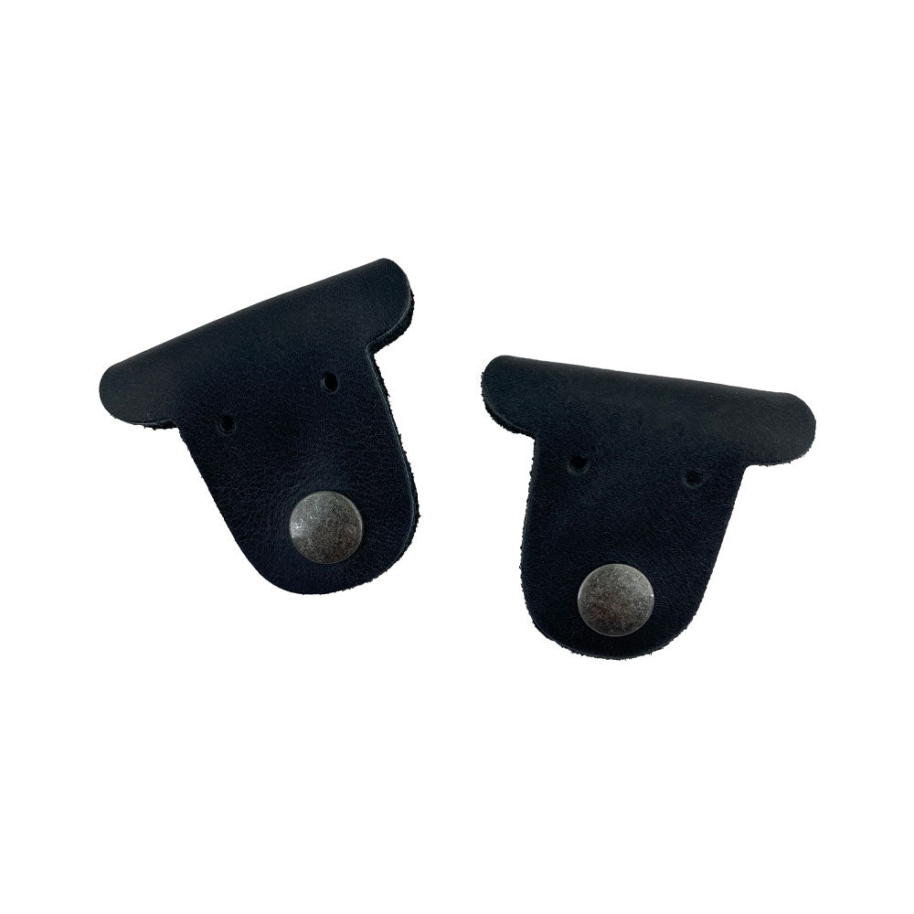 Two black Dog Shaped Cord Keepers by Hide & Drink, highlighting unique cord management with premium Full Grain Leather materials. Dog Shaped Cord Keeper (Cord Clam) 2-Pack, Full Grain Leather, StockyardX, Small Batch Production, Hand Cut, Hand Sewn, Fire Branded, Artisan, Handmade in La Antigua Guatemala & Oaxaca Mexico.
