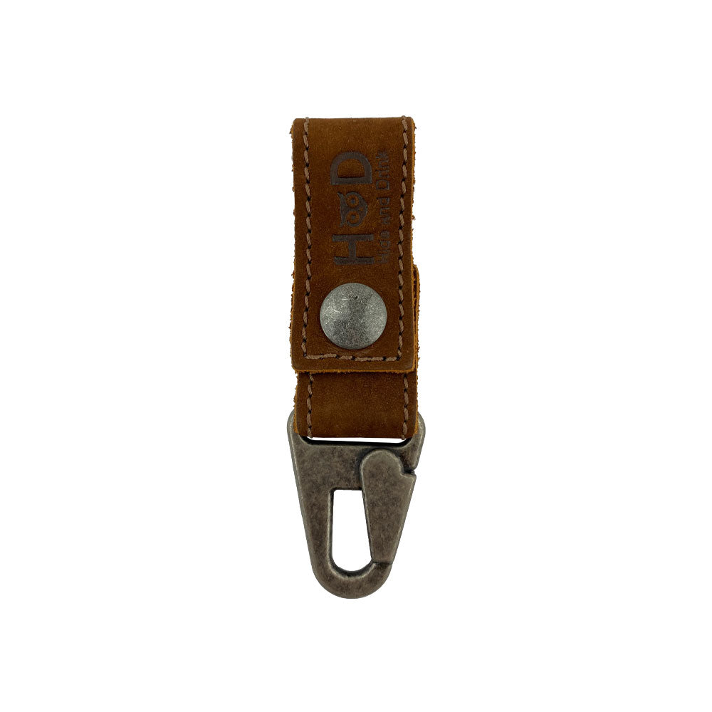 Front view of the Key Ring Holder by Hide & Drink, showcasing its tactile Full Grain Leather finish. This Key Ring Holder is a testament to Small Batch Production with careful Hand Cut and Hand Sewn accents, highlighted by its signature Fire Branded logo. Each piece is proudly made Artisan-style in La Antigua Guatemala & Oaxaca Mexico.