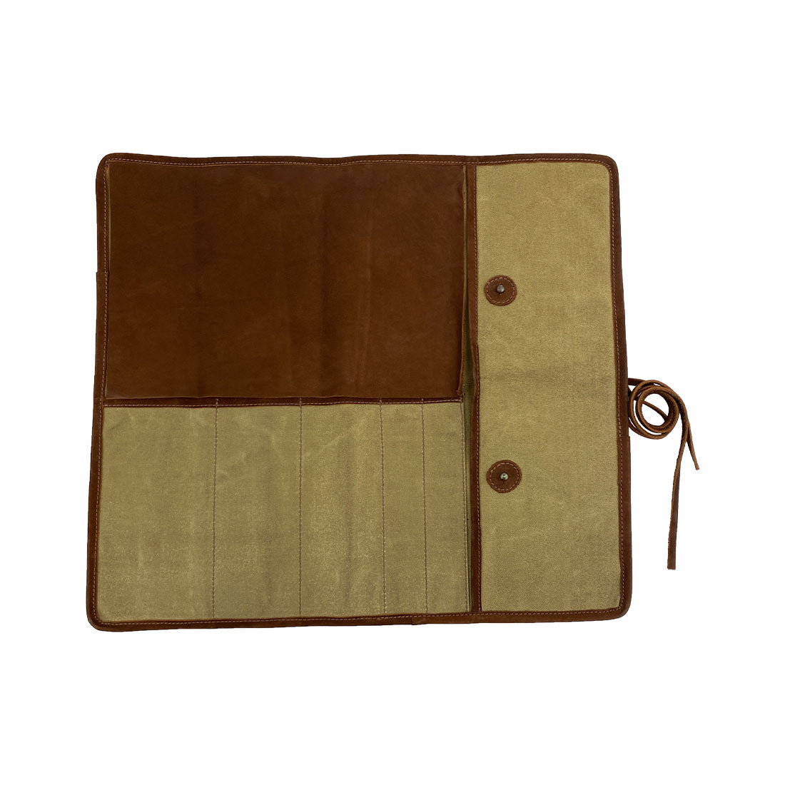Hide & Drink Knife Roll (5 Pockets) elegantly folded, crafted from exquisite Full Grain Leather. This Chef Knife Bag functions as a portable carrying case for knives, showcasing the meticulous artisan workmanship from small batch production, with hand cut and hand sewn features.