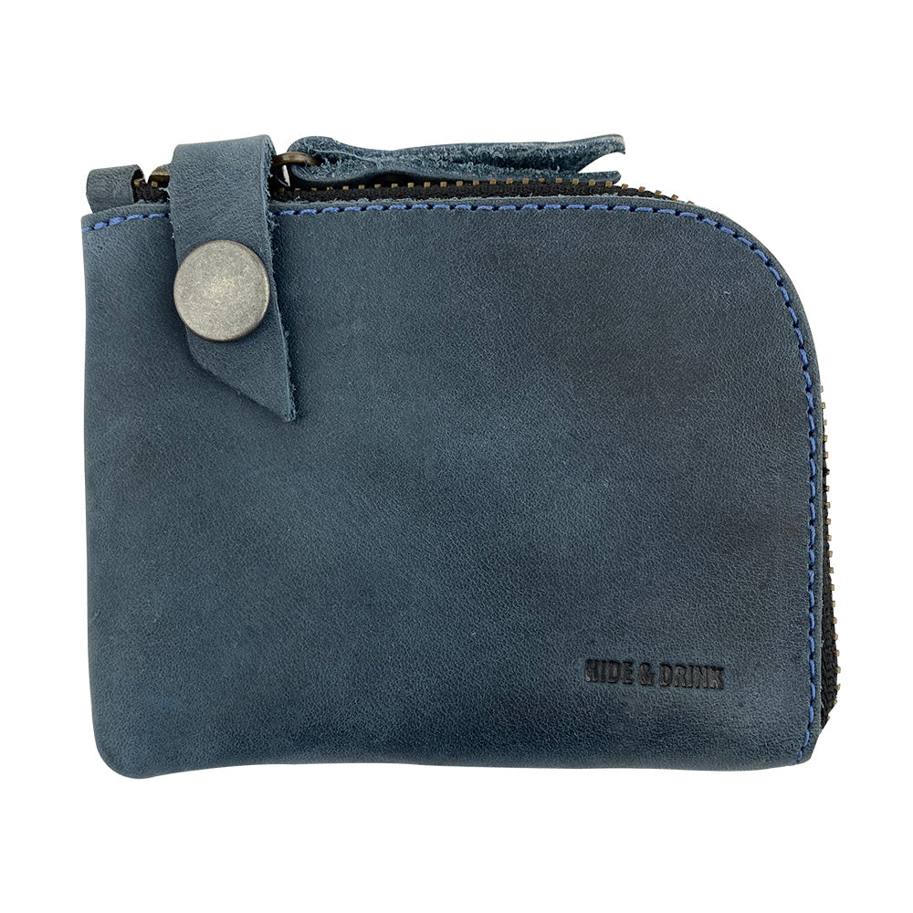Blue Lion's Mane Zippered Wallet by Hide & Drink, made of luxurious full grain leather. A mini pocket-size wallet that holds cards and cash securely, perfect as a travel essential or daily accessory.