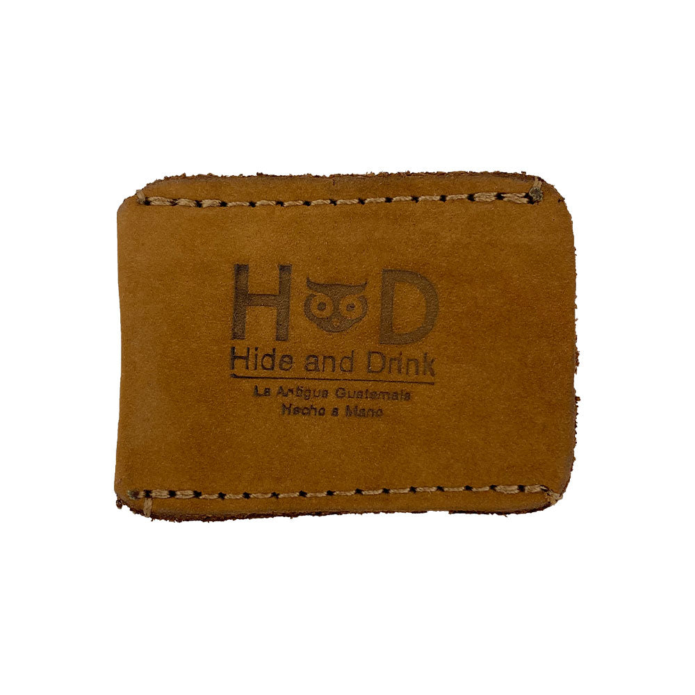 Highlighting the embossed logo on the Razor Head Cover by Hide & Drink, this full grain leather sheath protects your double edge safety razor. A practical shaving travel cover, it represents small batch production and artisan craftsmanship, being hand cut, hand sewn, and fire branded in La Antigua Guatemala & Oaxaca Mexico.