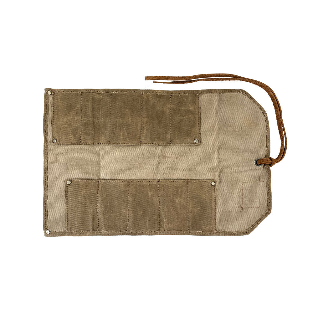 Hide & Drink Tool Roll showcases a versatile small tool roll-up bag with 10 slots, constructed from durable full grain leather. Ideal as a portable carry-on pouch for organizing woodworking tools, it improves workshop storage efficiency. Handcrafted in La Antigua Guatemala & Oaxaca Mexico, each item reflects artisanal quality.