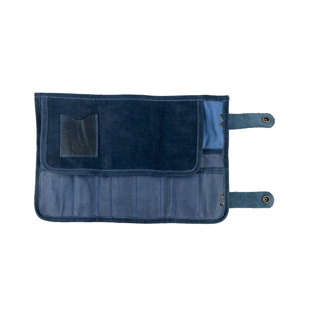 Hide & Drink's Barber Tool Roll shows a Snap Tool Roll Up Bag with 14 Slots suitable for scissors & screwdrivers. This portable carry case is made from premium Full Grain Leather and highlights StockyardX's focus on small batch production, artisan craftsmanship, hand cut, hand sewn, and fire branded in La Antigua Guatemala & Oaxaca Mexico.
