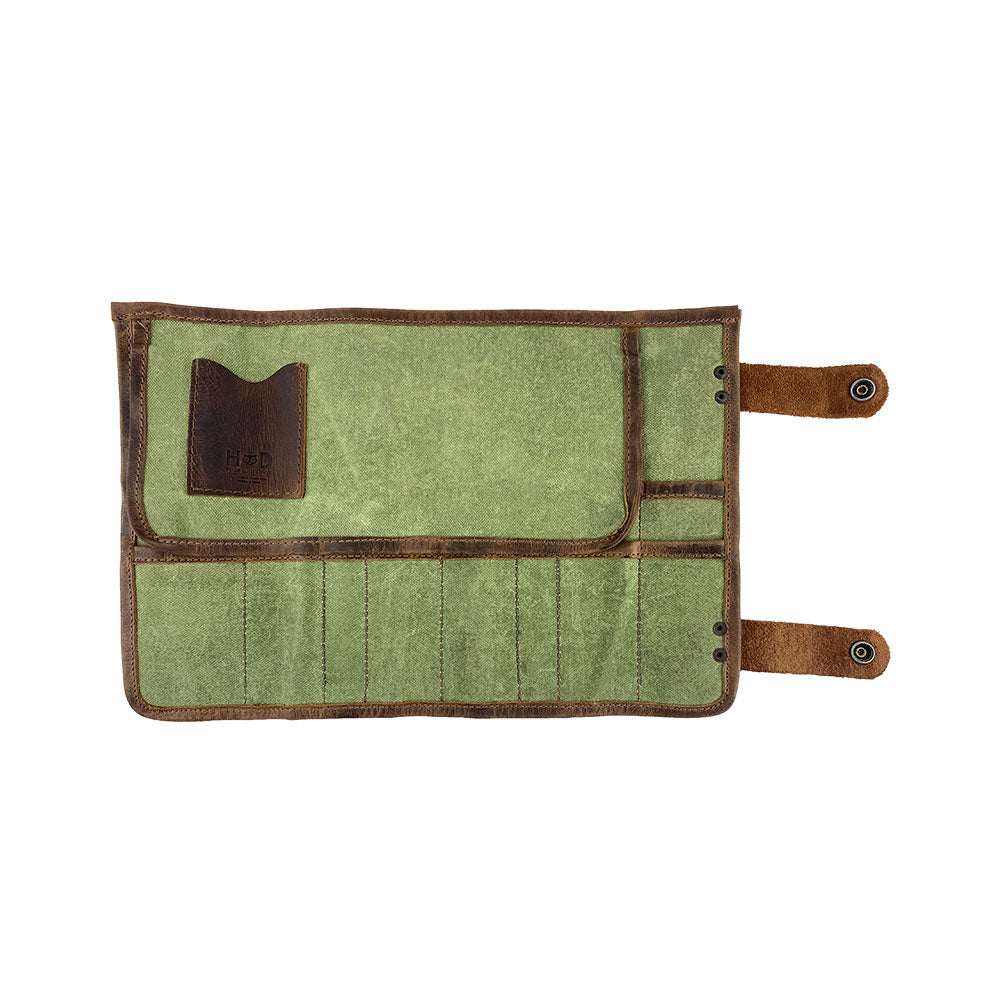 Flat view of Hide & Drink's Barber Tool Roll, a Snap Tool Roll Up Bag with 14 Slots, perfect for scissors & screwdrivers. Constructed from durable Full Grain Leather, this portable carry case aligns with StockyardX's small batch production approach and showcases artisan craftsmanship, hand cut, hand sewn, and fire branded in La Antigua Guatemala & Oaxaca Mexico.
