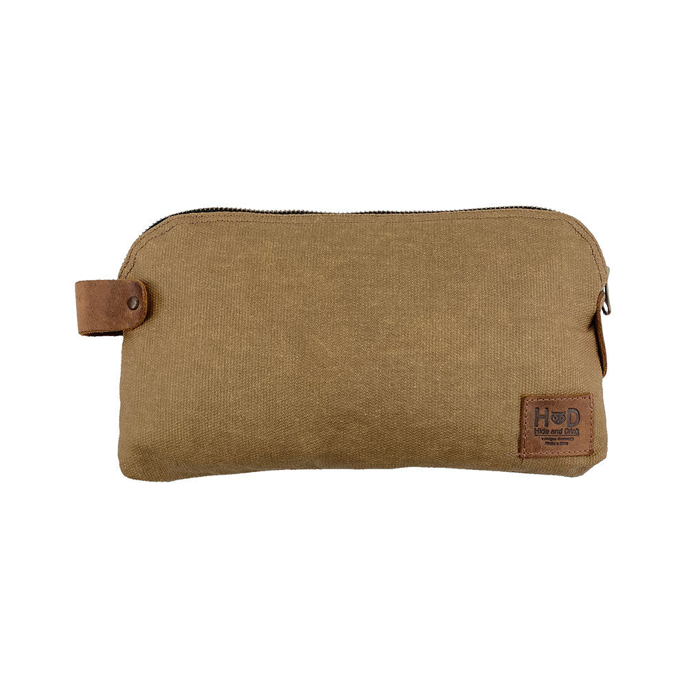 Dopp Kit Utility Bag by Hide & Drink featuring sleek leather crafting ideal for modern use. This artisan Dopp Kit Utility Bag serves multiple functions and is made from high-quality full grain leather showcasing hand cut and hand sewn craftsmanship, handmade in La Antigua Guatemala & Oaxaca Mexico.