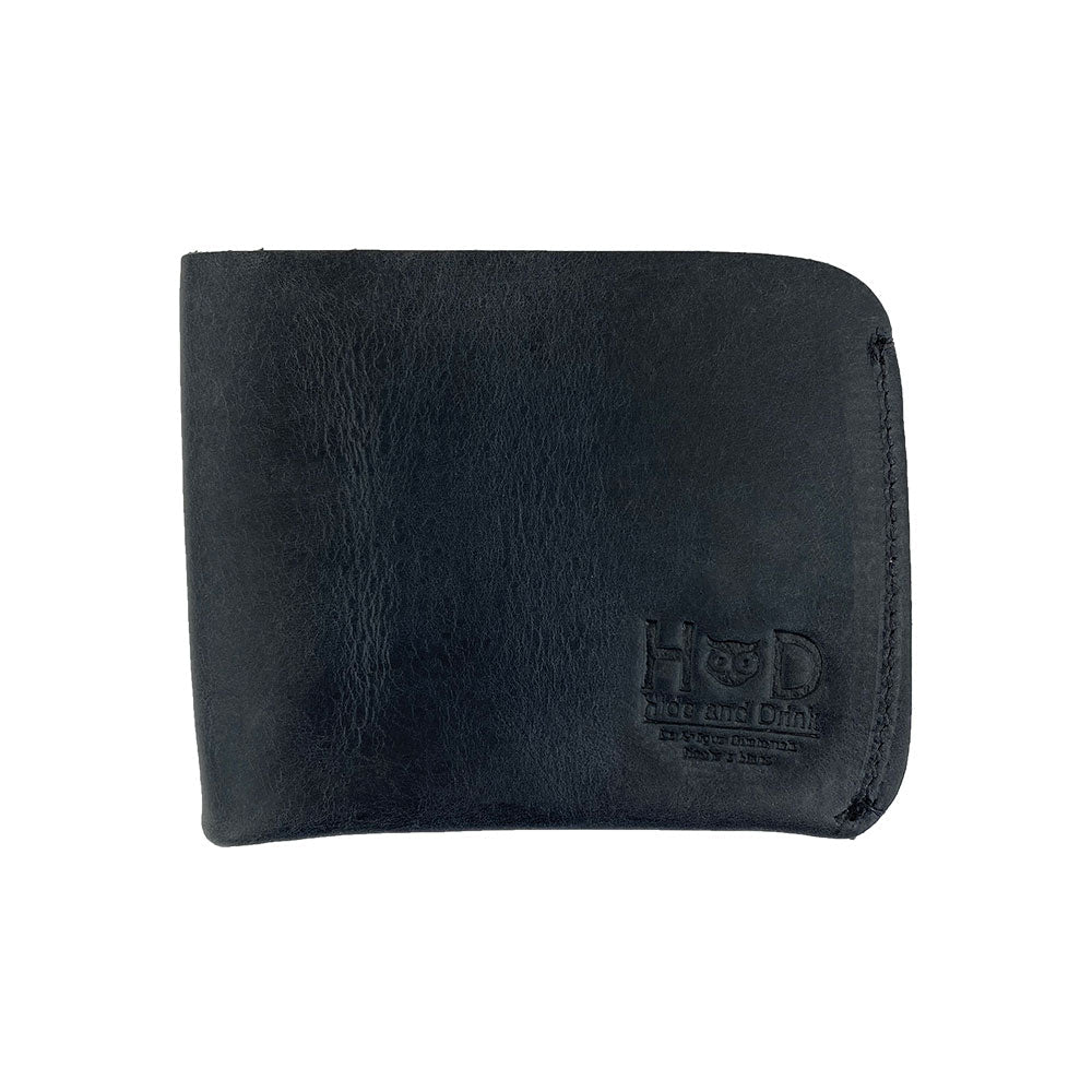 Side view of the Hide & Drink Minimal Wallet in jet black Full Grain Leather, depicting its smooth texture. This Classic Slimfold Wallet serves as a Card Organizer Holder and Travel Accessory, showcasing the artistry of Small Batch Production by artisans in La Antigua Guatemala & Oaxaca Mexico.