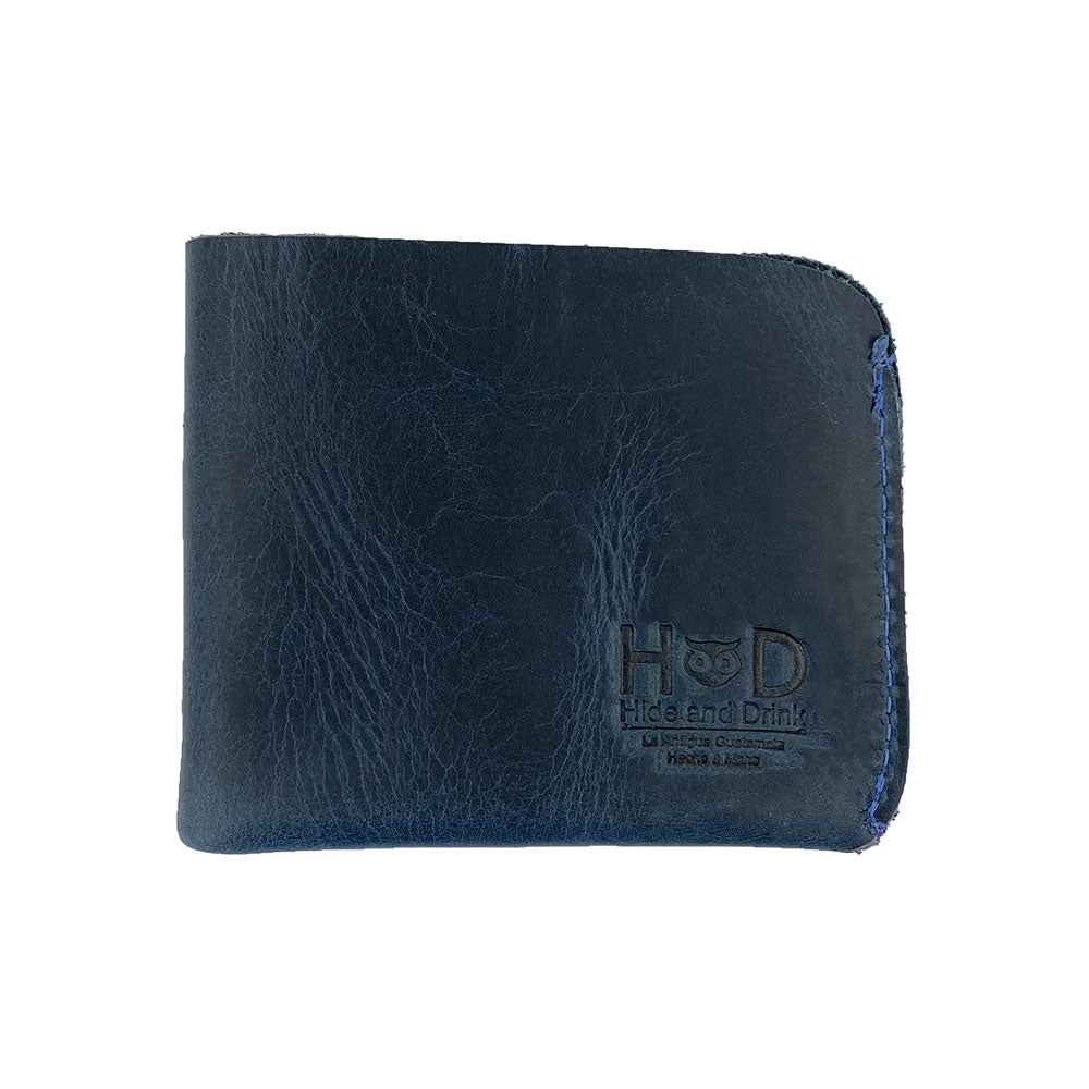 Front view of the Hide & Drink Minimal Wallet in deep blue, made with Full Grain Leather. This Classic Slimfold Wallet is an excellent Card Organizer Holder and Travel Accessory, showcasing the excellence of Small Batch Production with Hand Cut and Hand Sewn craftsmanship from artisans in La Antigua Guatemala & Oaxaca Mexico.