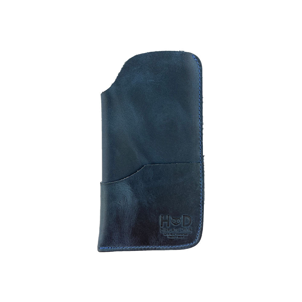 Feature angle of the Hide & Drink Sunglass Case & Wallet in navy, displaying its refined style. This Rustic Sunglasses Case & Wallet offers optimum protection for your eyeglasses, crafted from Full Grain Leather and perfect for travel, artisan-made in La Antigua Guatemala & Oaxaca Mexico.