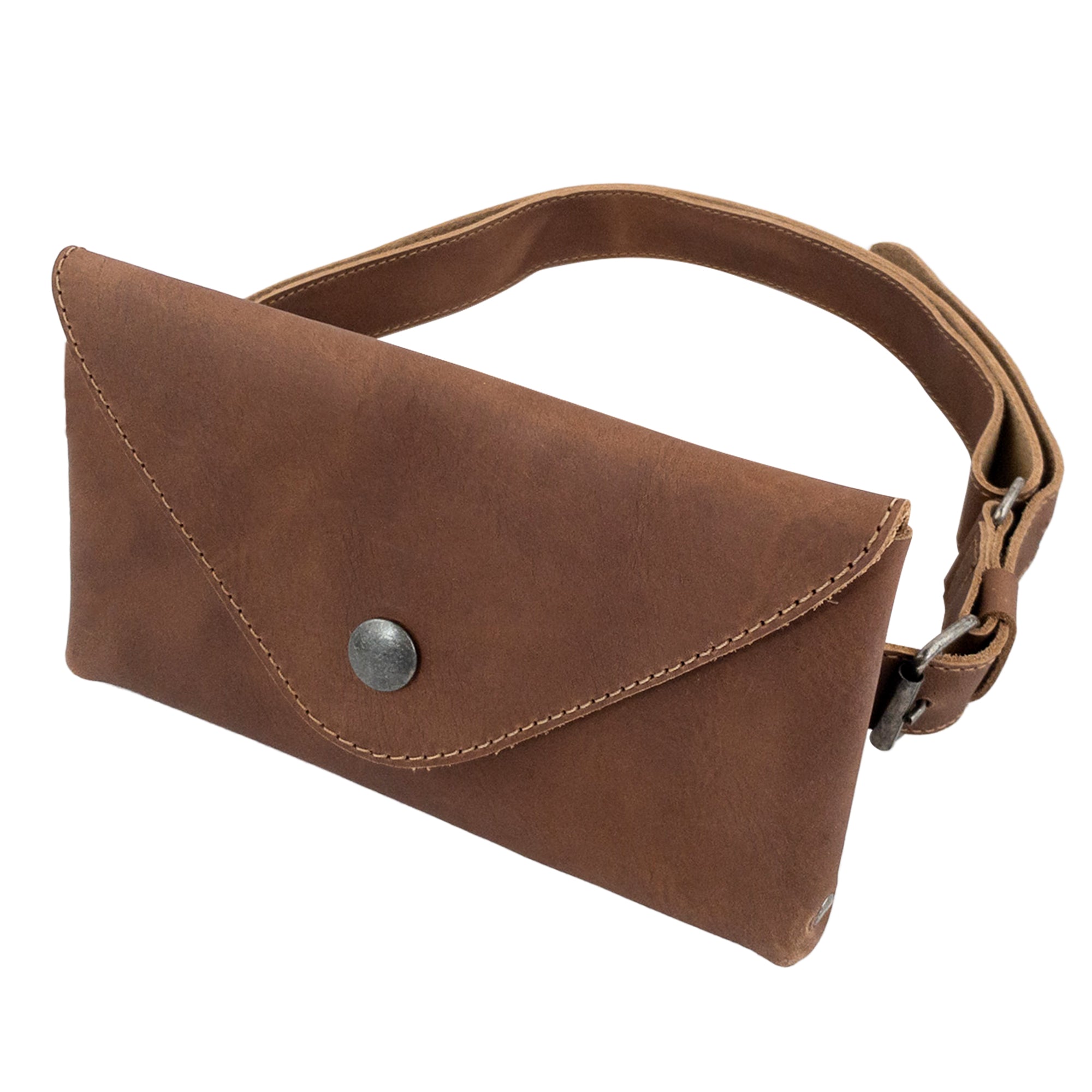 Showcasing Hide & Drink's Fancy Fanny Pack in rustic brown leather, ideal for style and practicality. This artisan piece serves as both a fanny pack and phone holder, crafted with full grain leather, highlighting handmade quality from La Antigua Guatemala.