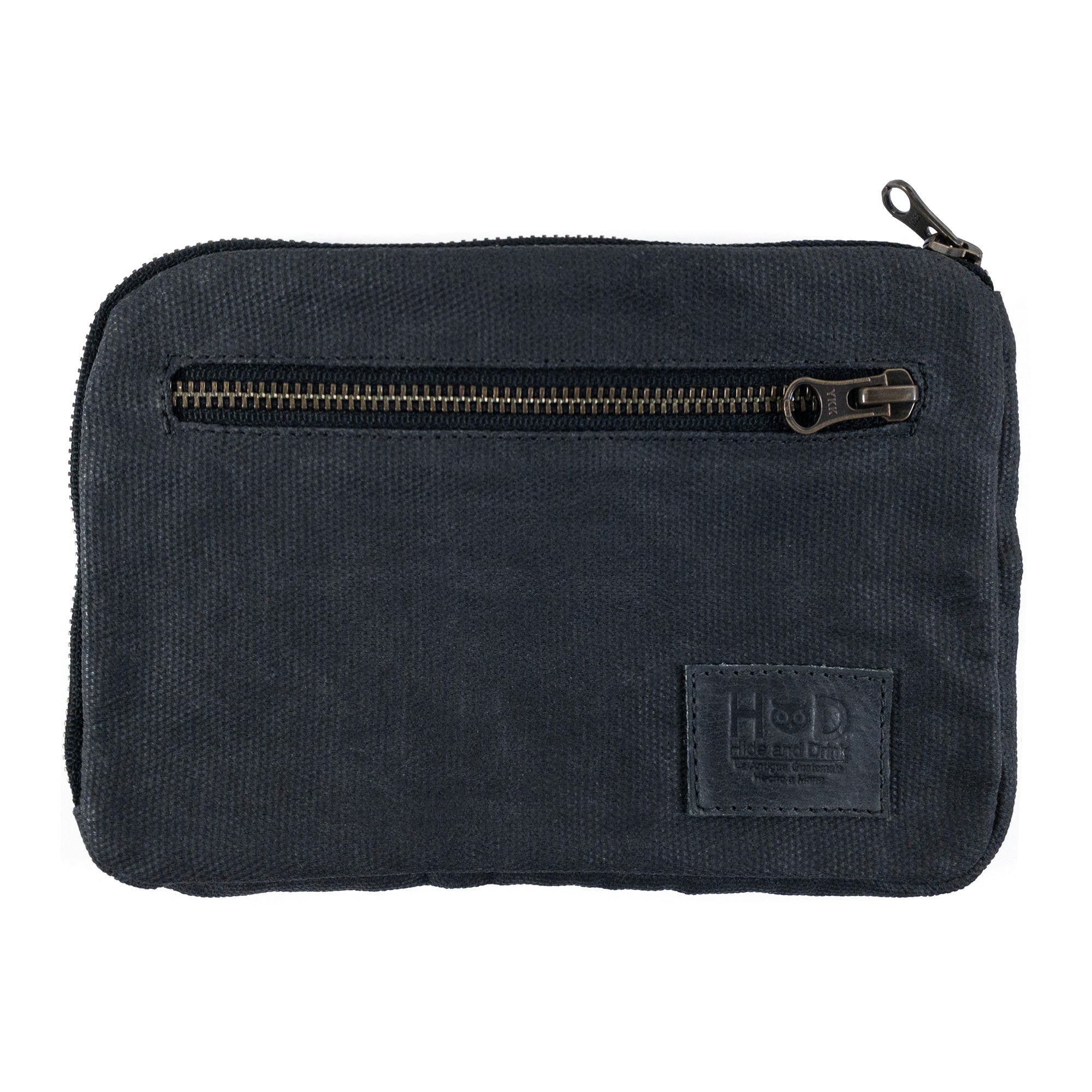 Hide & Drink's Zipper Gear Pouch in a dark brown color showing its sturdy zipper, reflecting its artisan craftsmanship and functionality as a camping accessory, made from water resistant waxed canvas.
